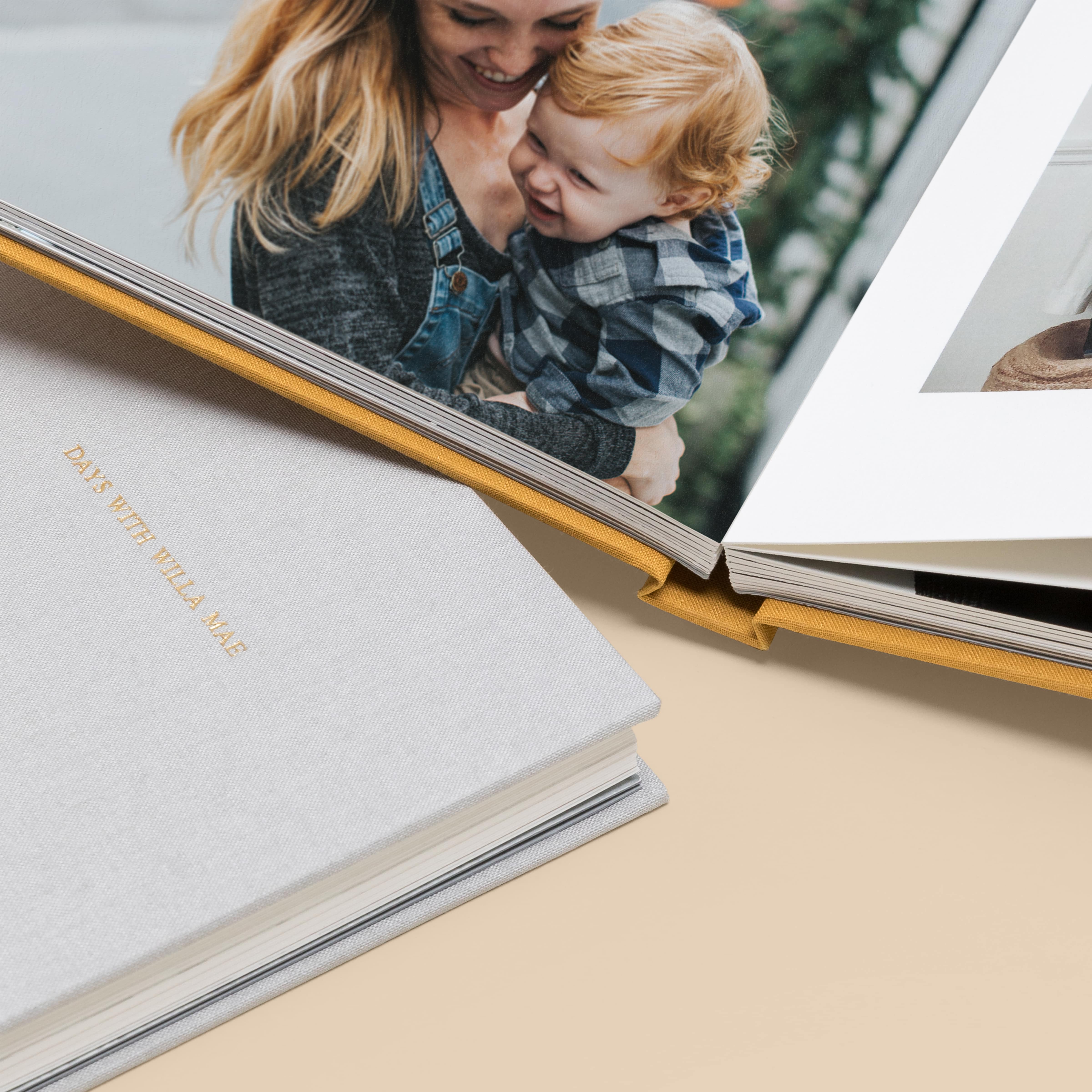 Zoomed in on Everyday Photo Book opened to image of mother holding little boy
