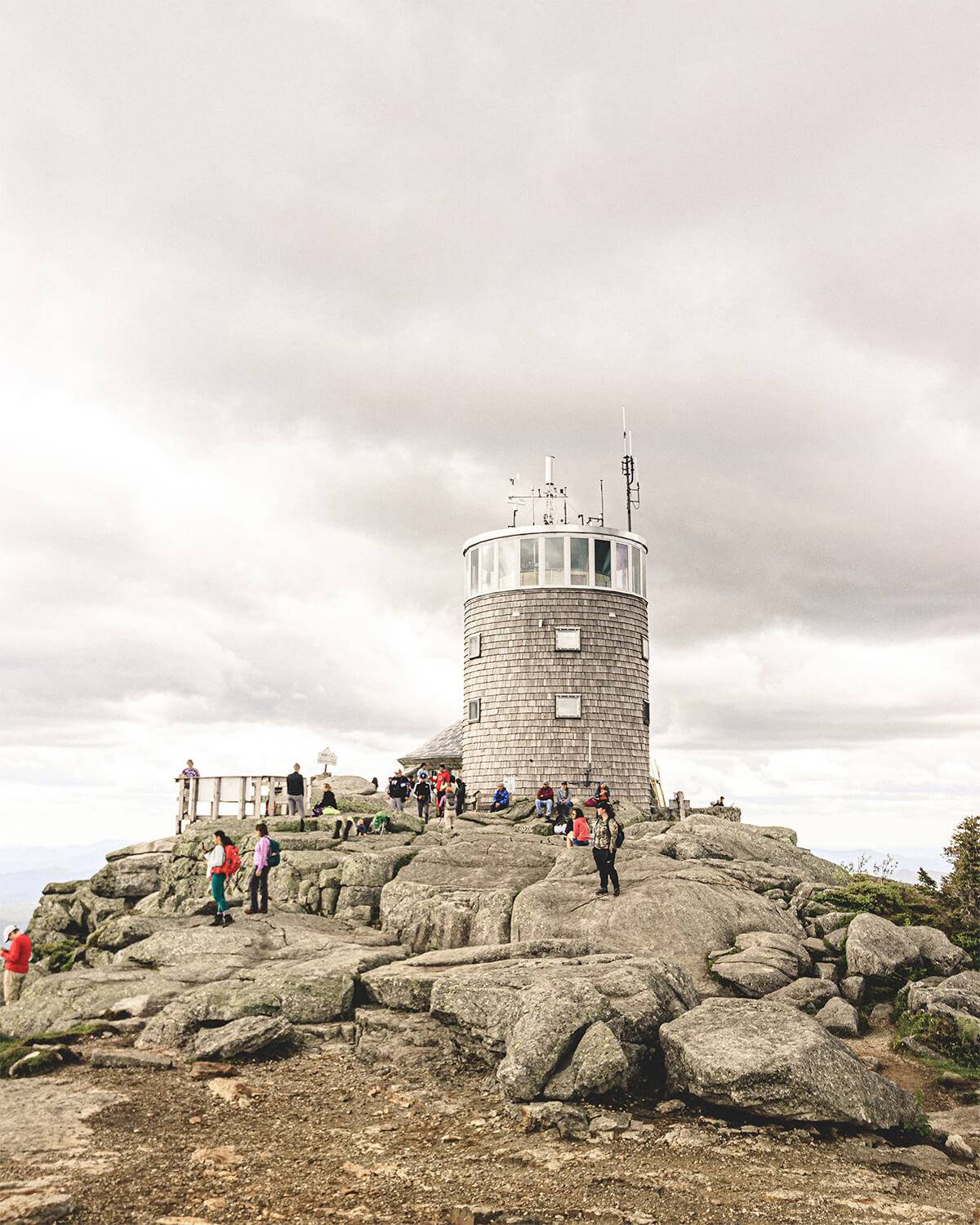 Hikers taking in the views around the lighthouse of Whiteface Mountain