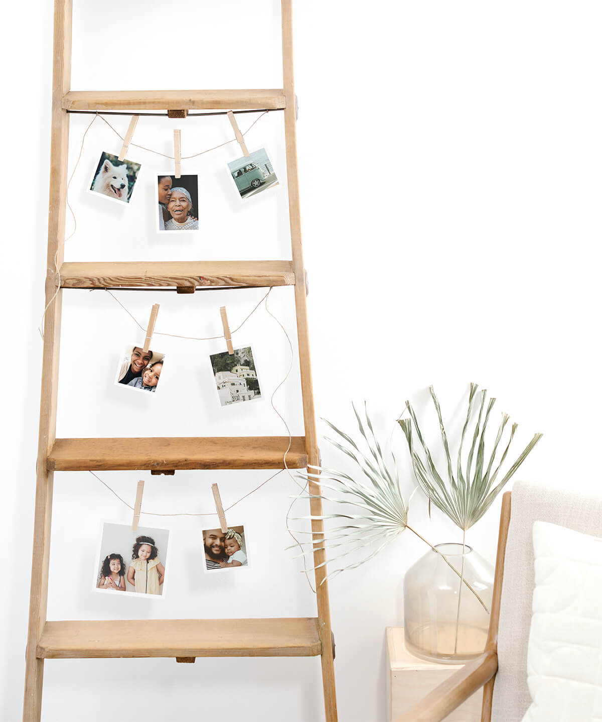 Wooden ladder repurposed for creative photo display