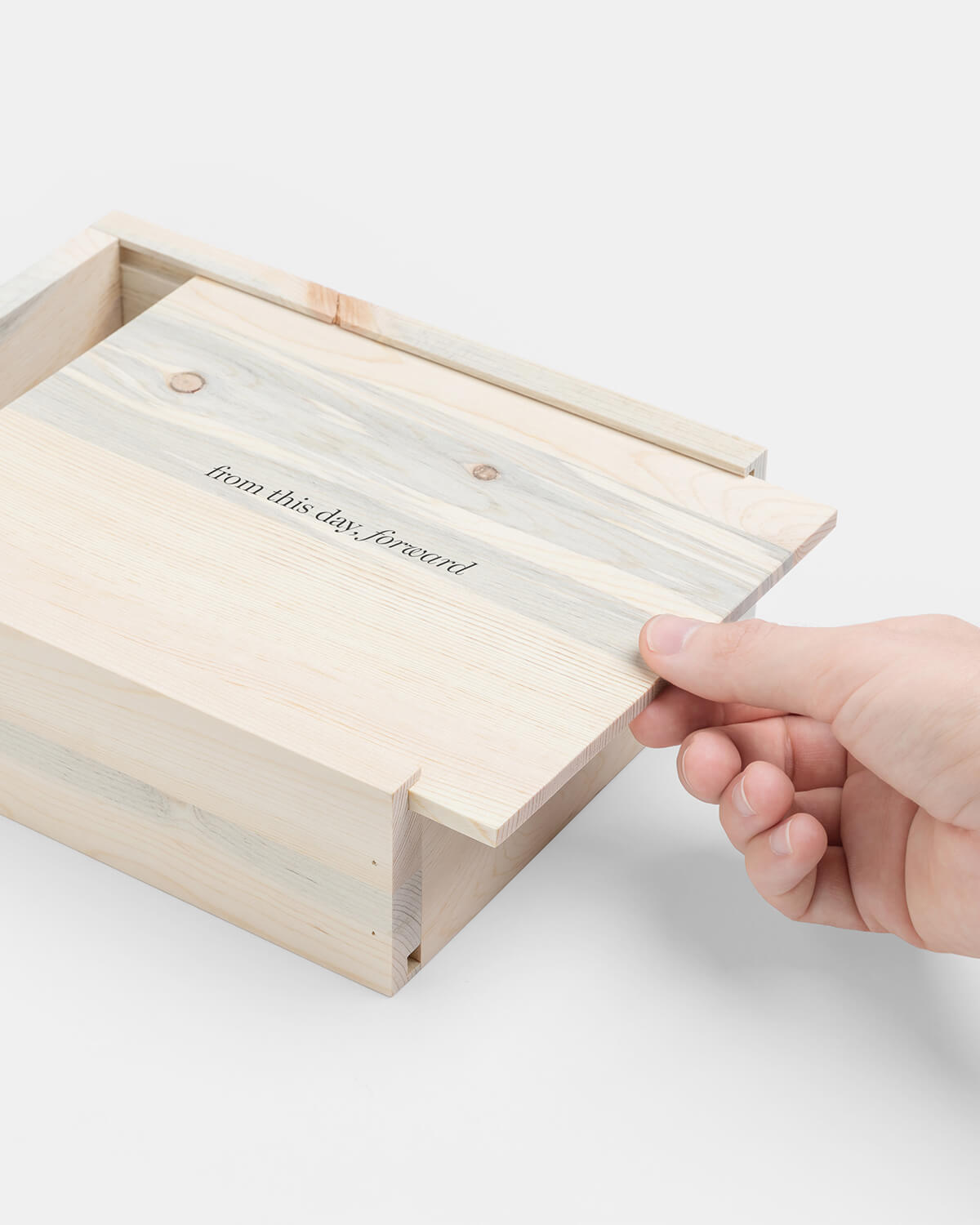 wooden quote box being opened by hand