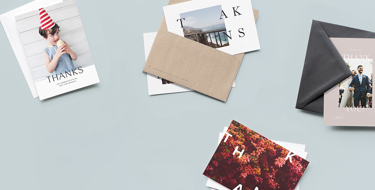 Different thank you cards laid out on a table