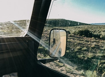 Sun rays shining through windshield of jeep