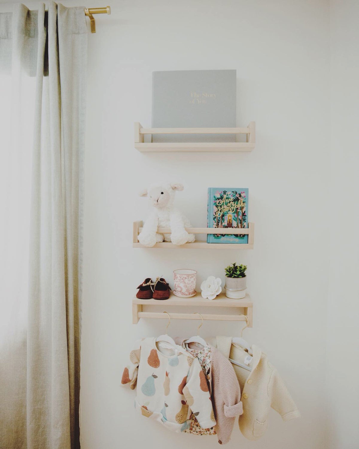 Wall storage in baby girl nursery room