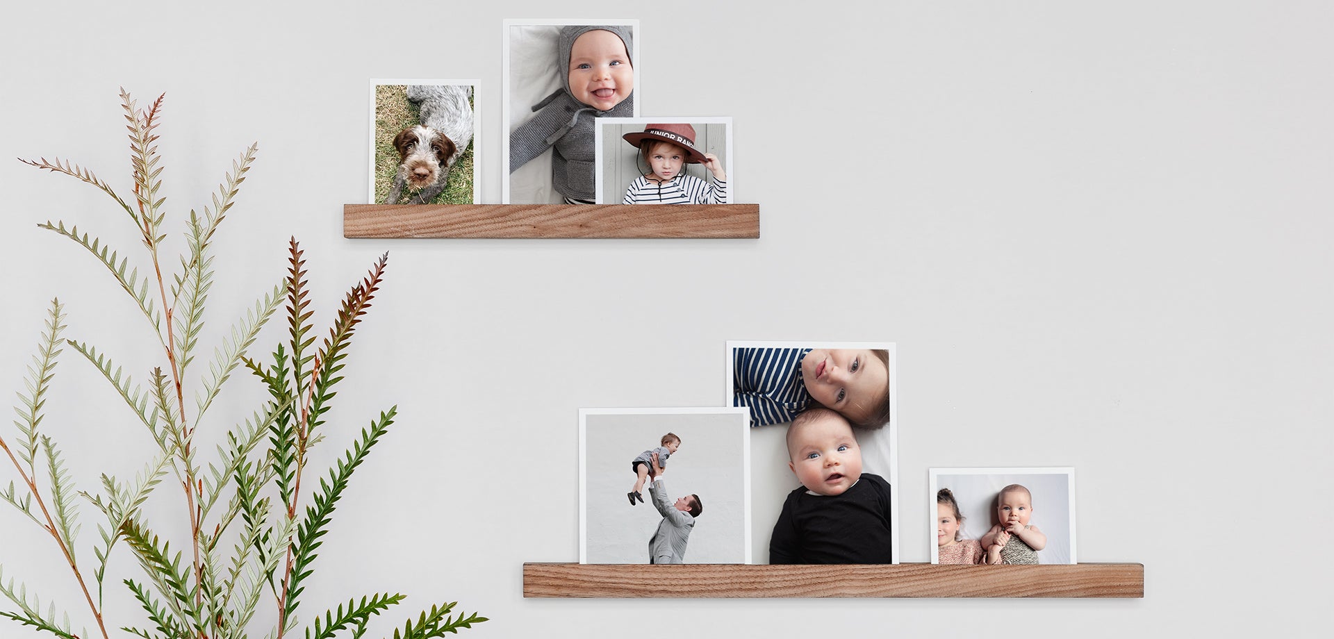 Photo prints on wooden ledges are one of many nursery wall decor ideas