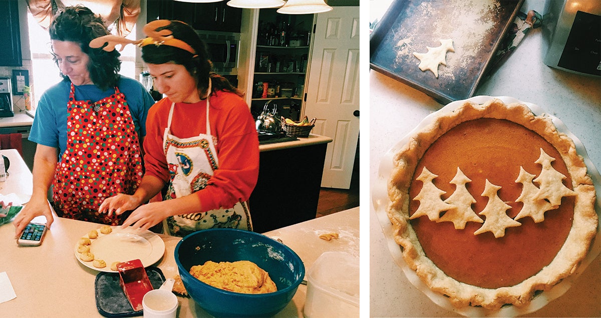 Mother and daughter baking pie in kitchen
