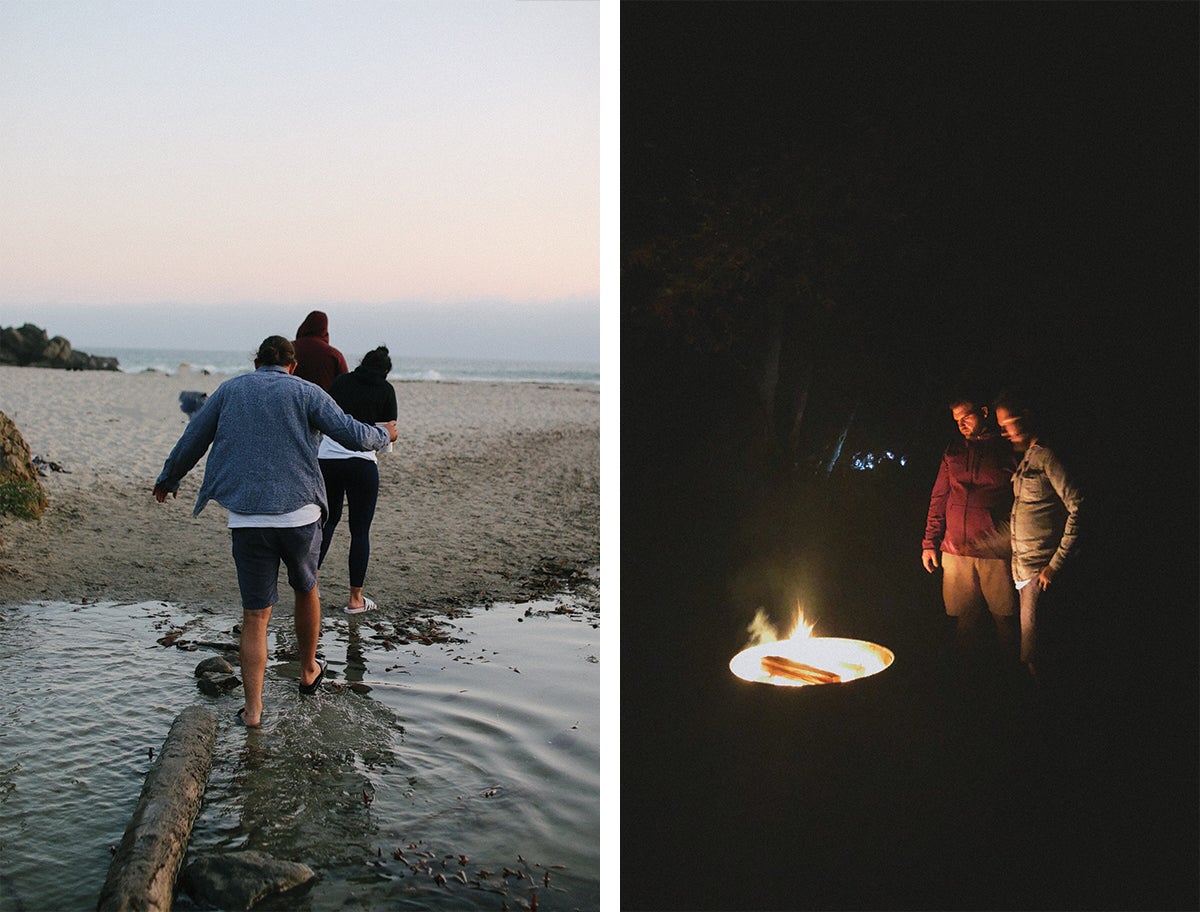 Trio of campers walking across log