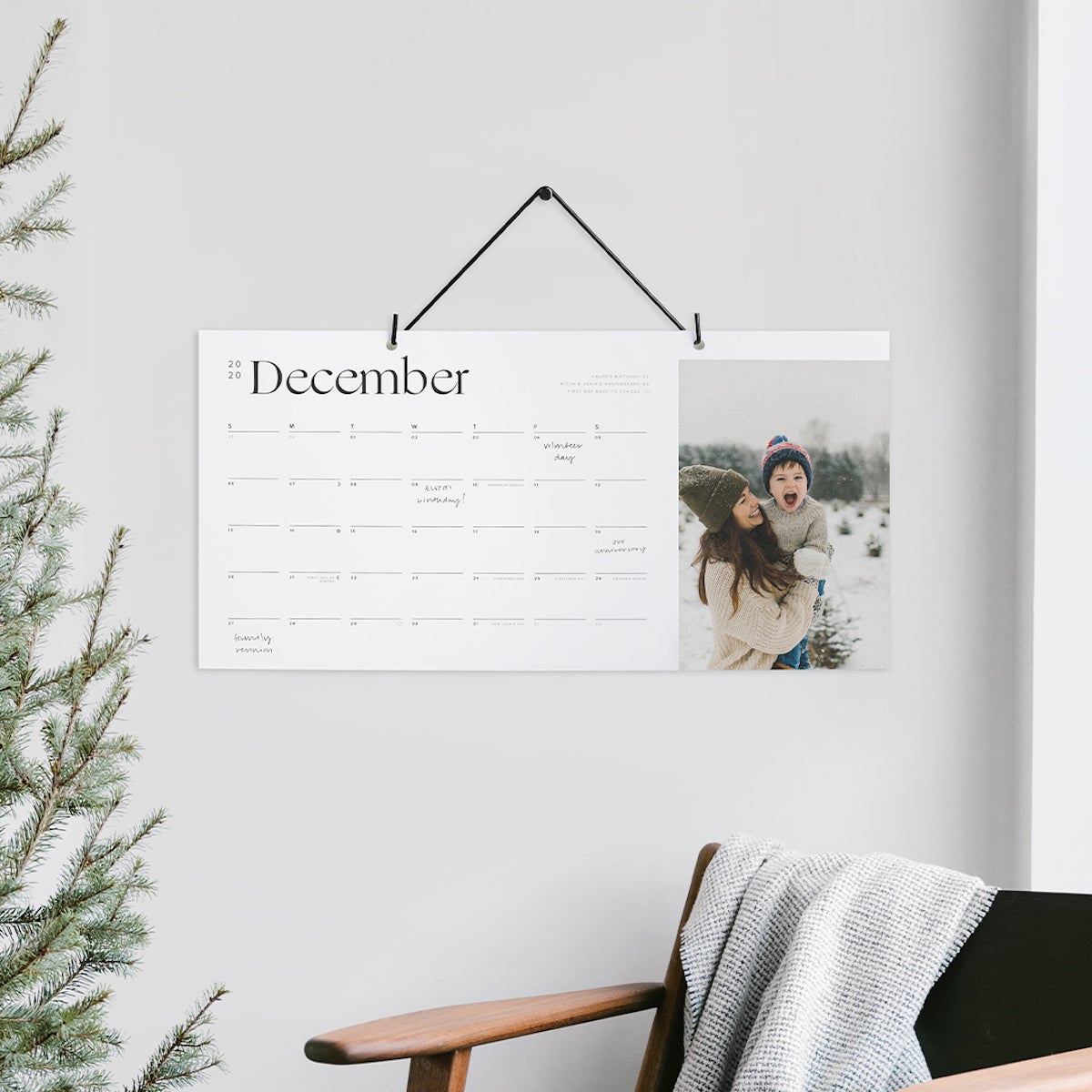 Wall calendar hanging above chair