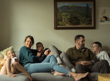 Family with children sitting on the couch