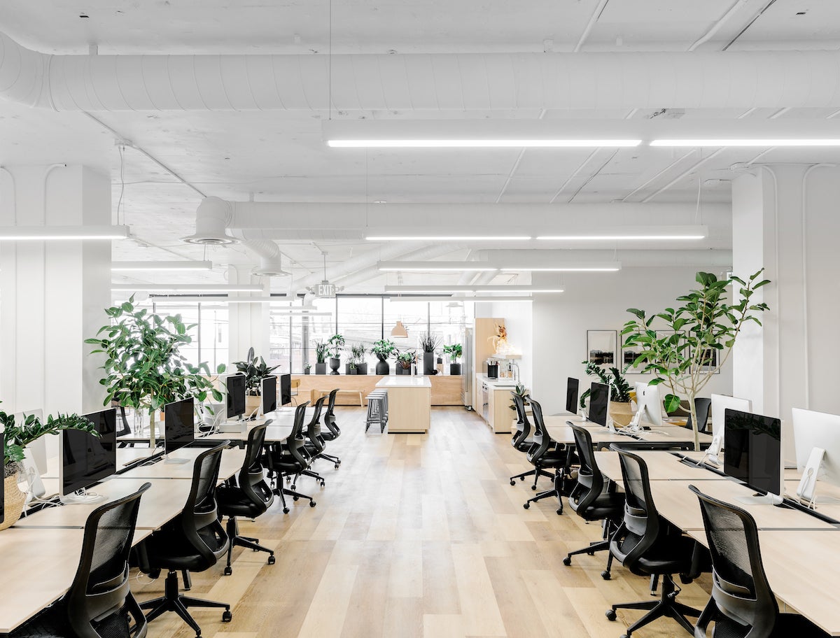 View down a row of desks in the Artifact Uprising office