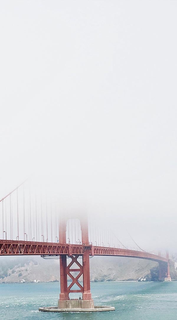 Cropped photo of Golden Gate Bridge shrouded in misty fog