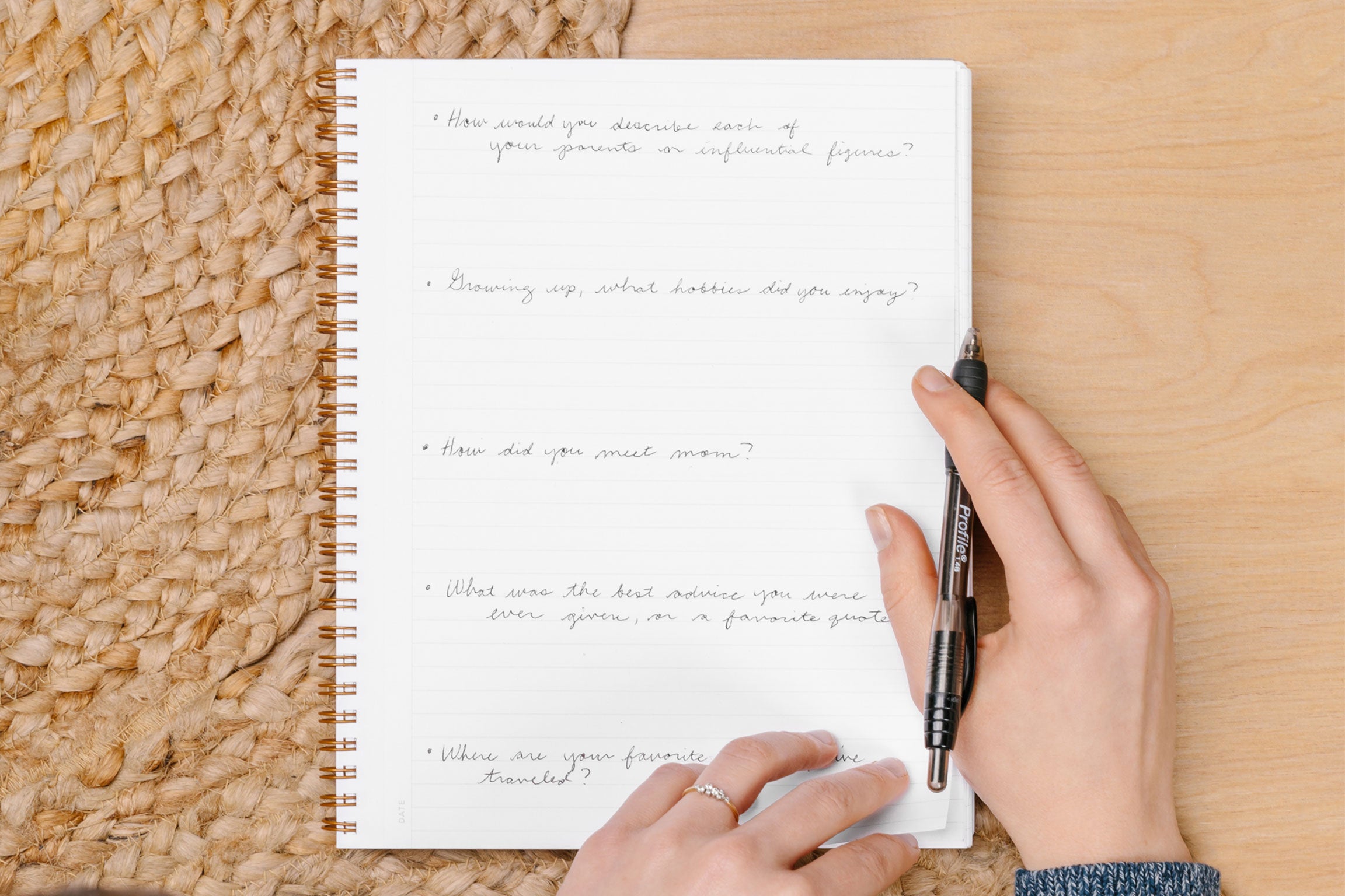 Woman writing family history questions