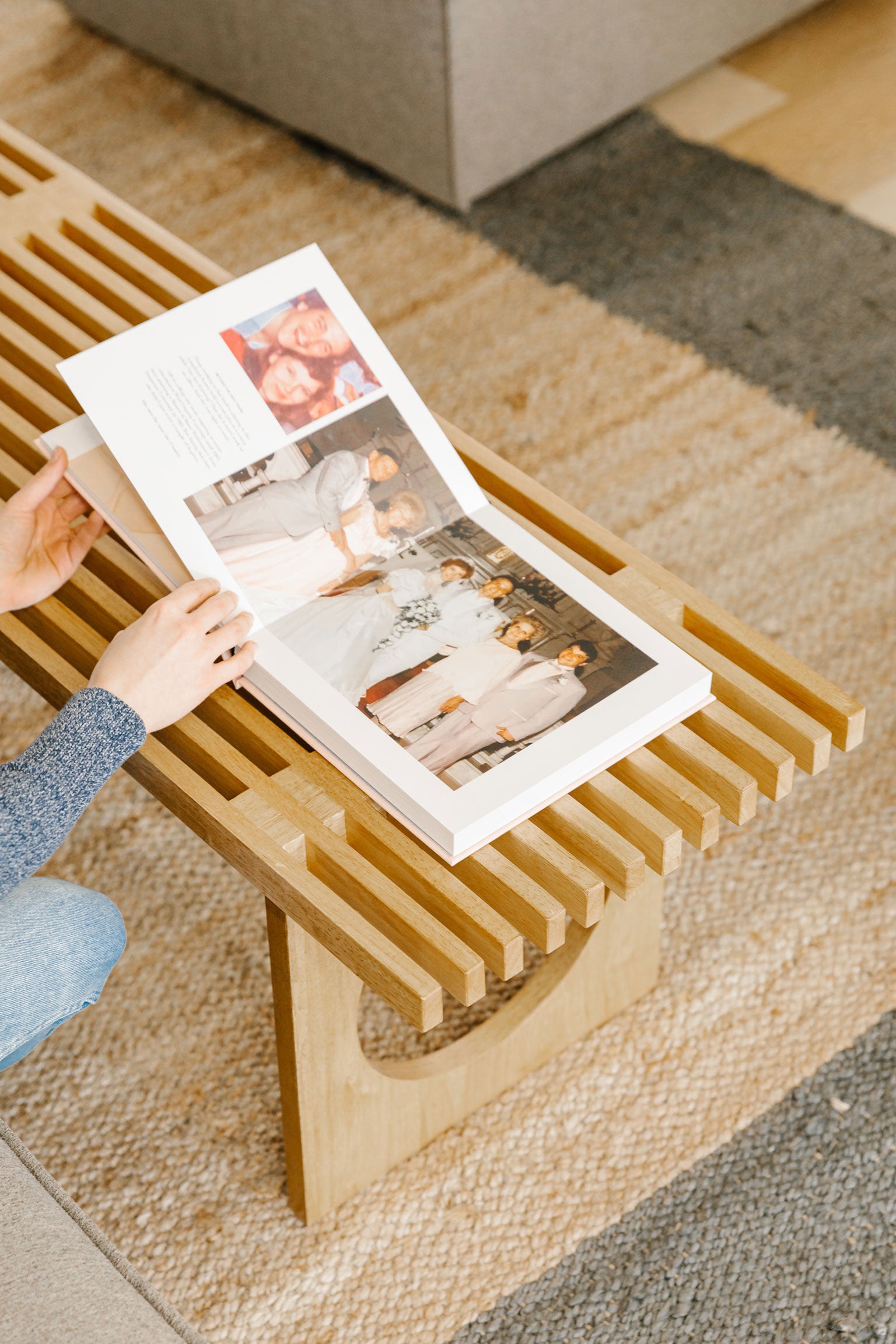 woman flipping through family history book early pages