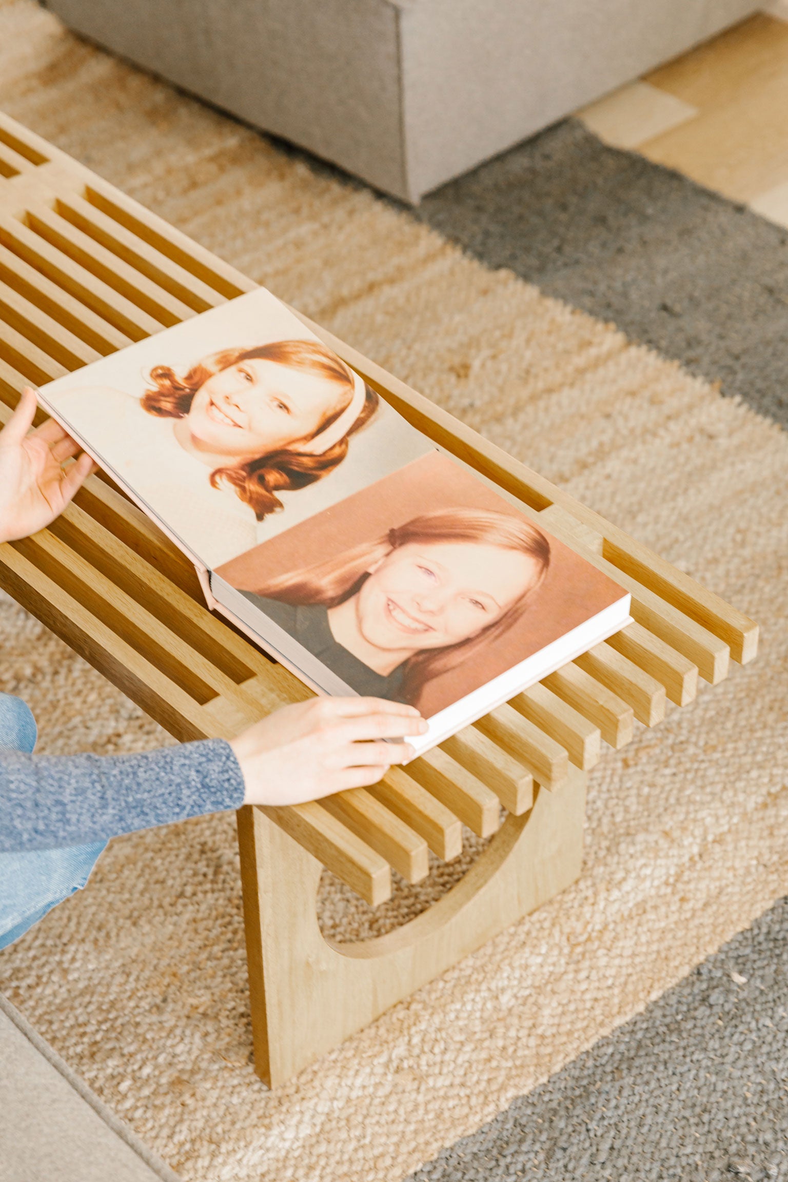 woman flipping through family history book later pages