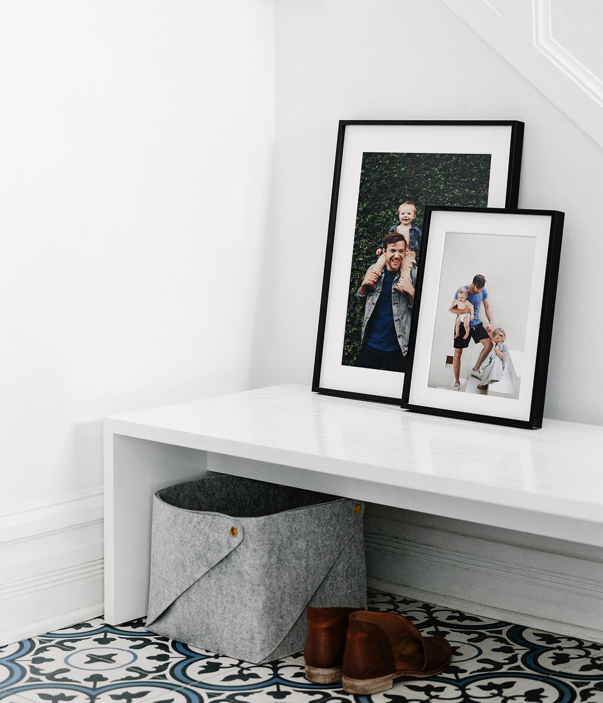 Metal frames stacked in a layered manner on top of small bench with shoes underneath