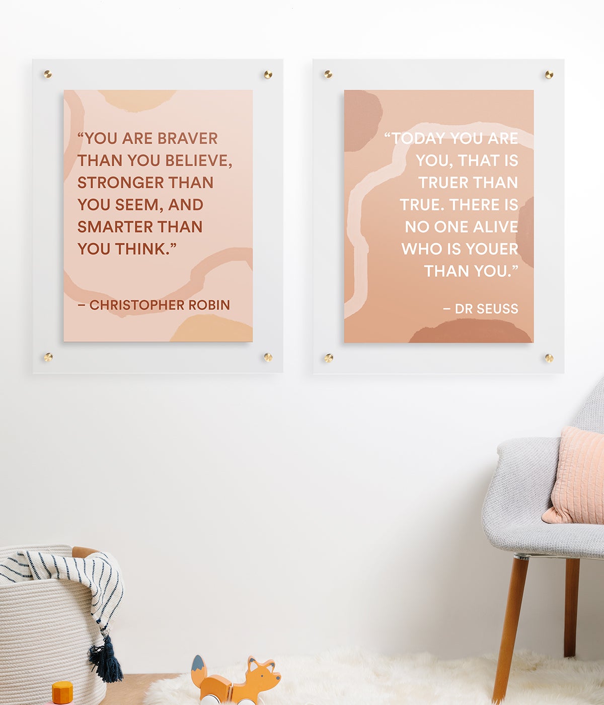Two identical frames in nursery room with quotes from Dr. Seuss and Christopher Robin