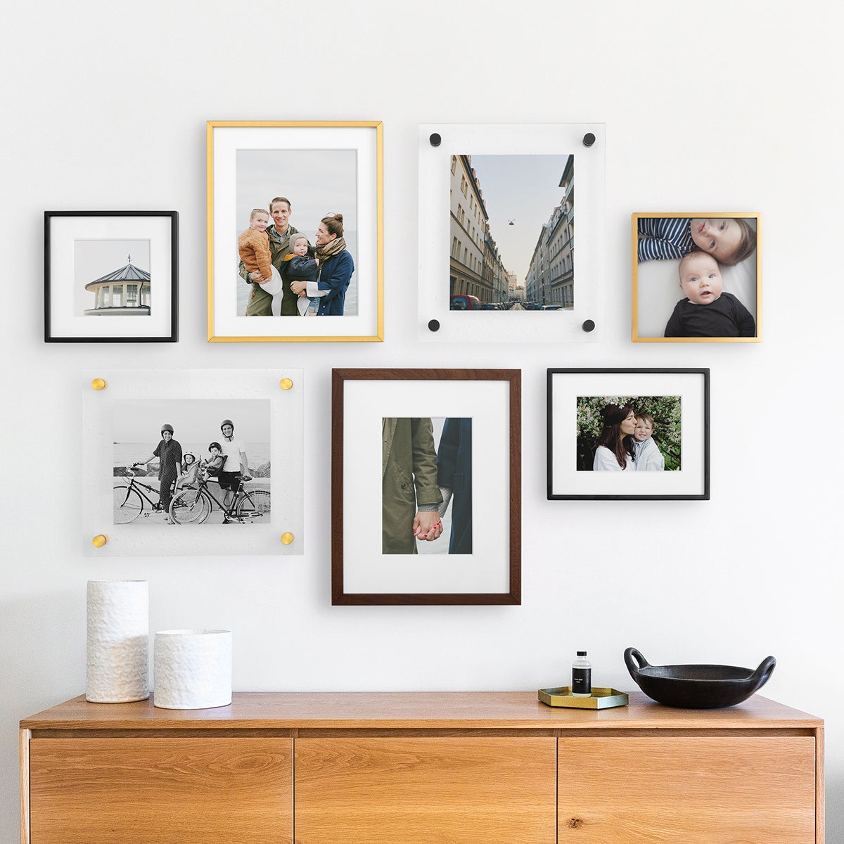 Gallery wall that mixes and matches sizes, styles, and finishes