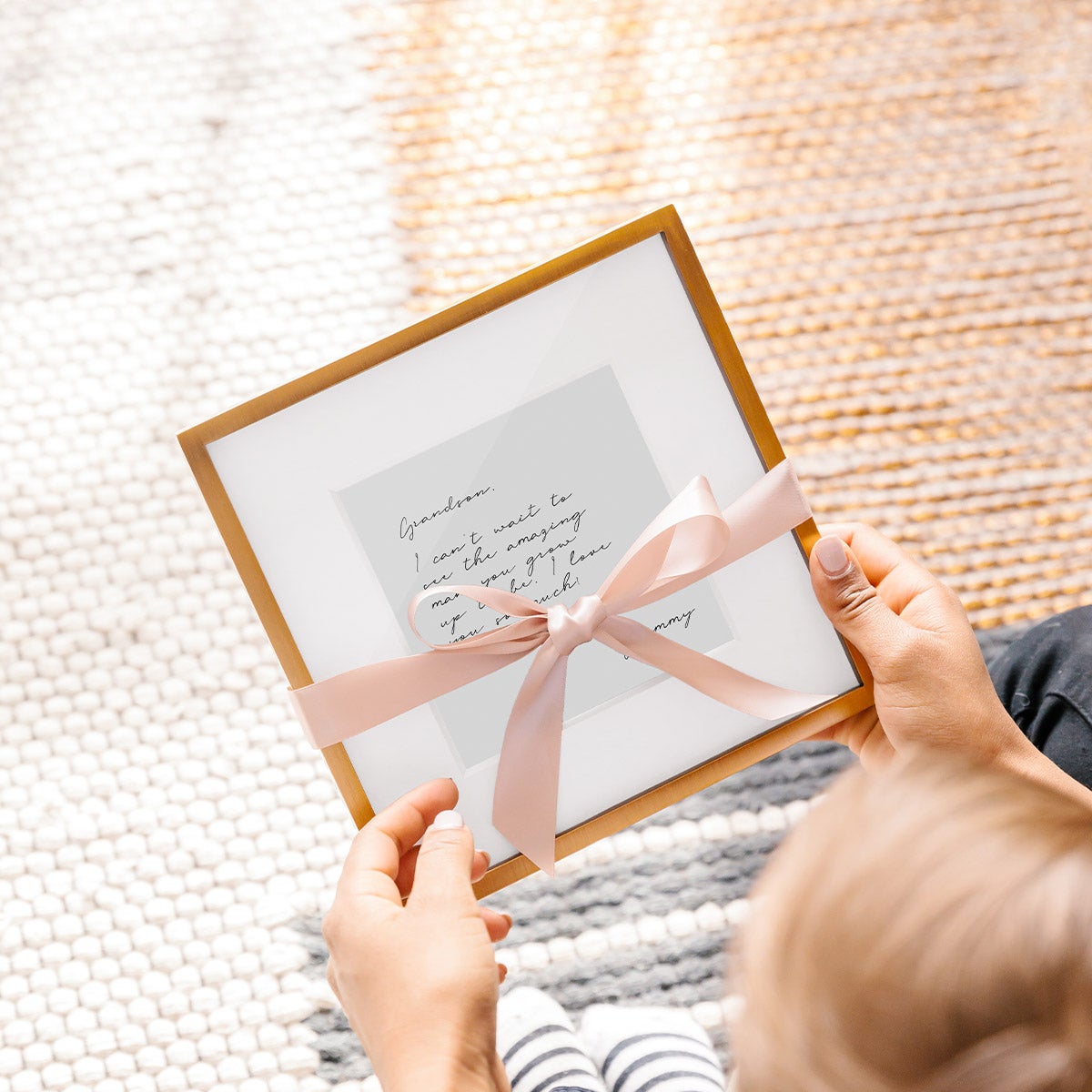 Framed note wrapped in pink bow