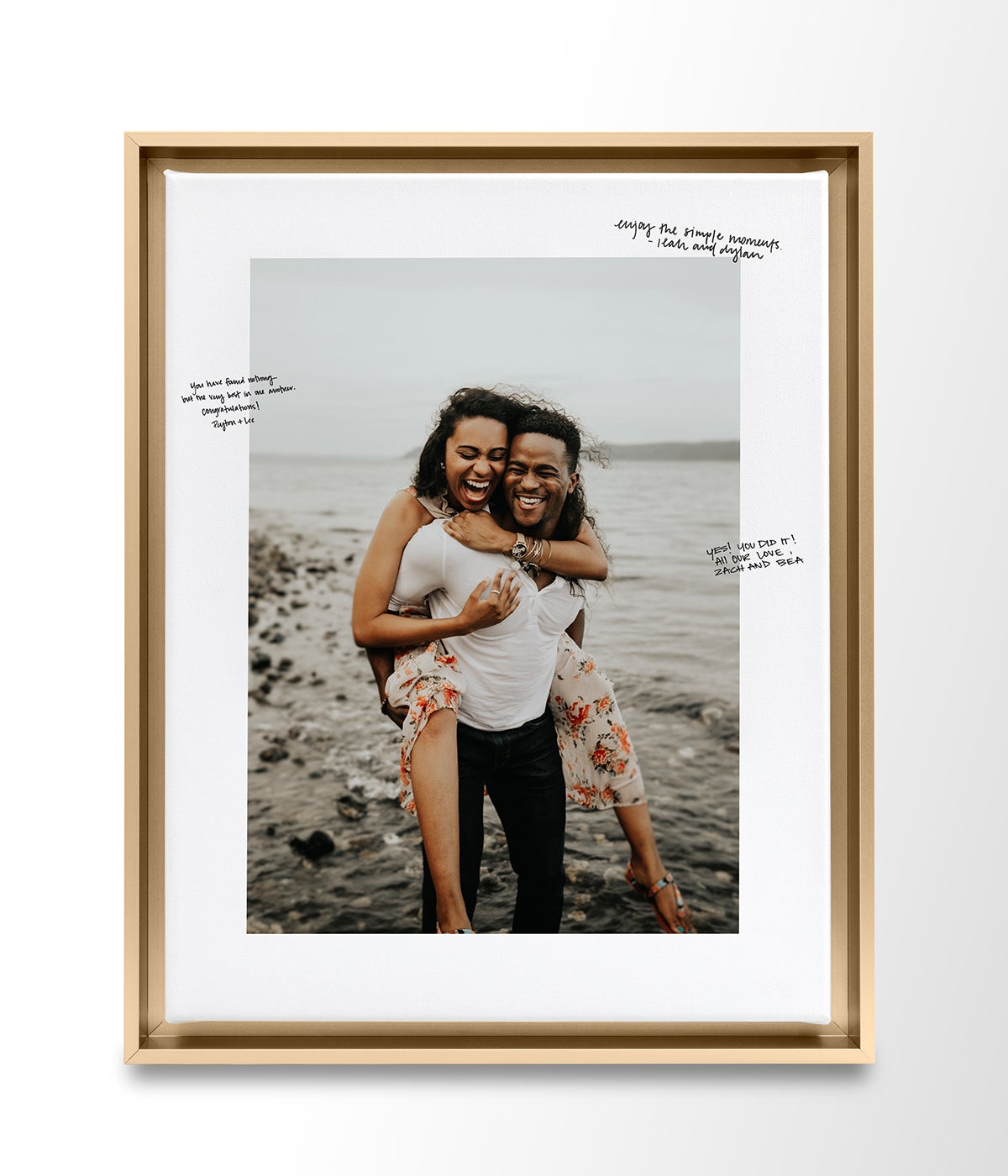 Artifact Uprising Wedding Guest Book Frame in Brass featuring engagement photo of couple and written messages from wedding guests