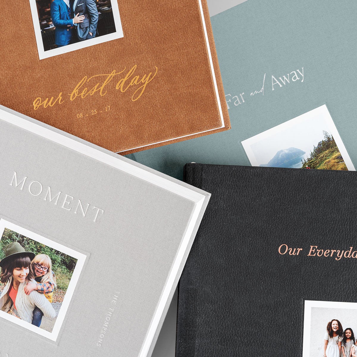 Four different Signature Layflat Albums in different colors