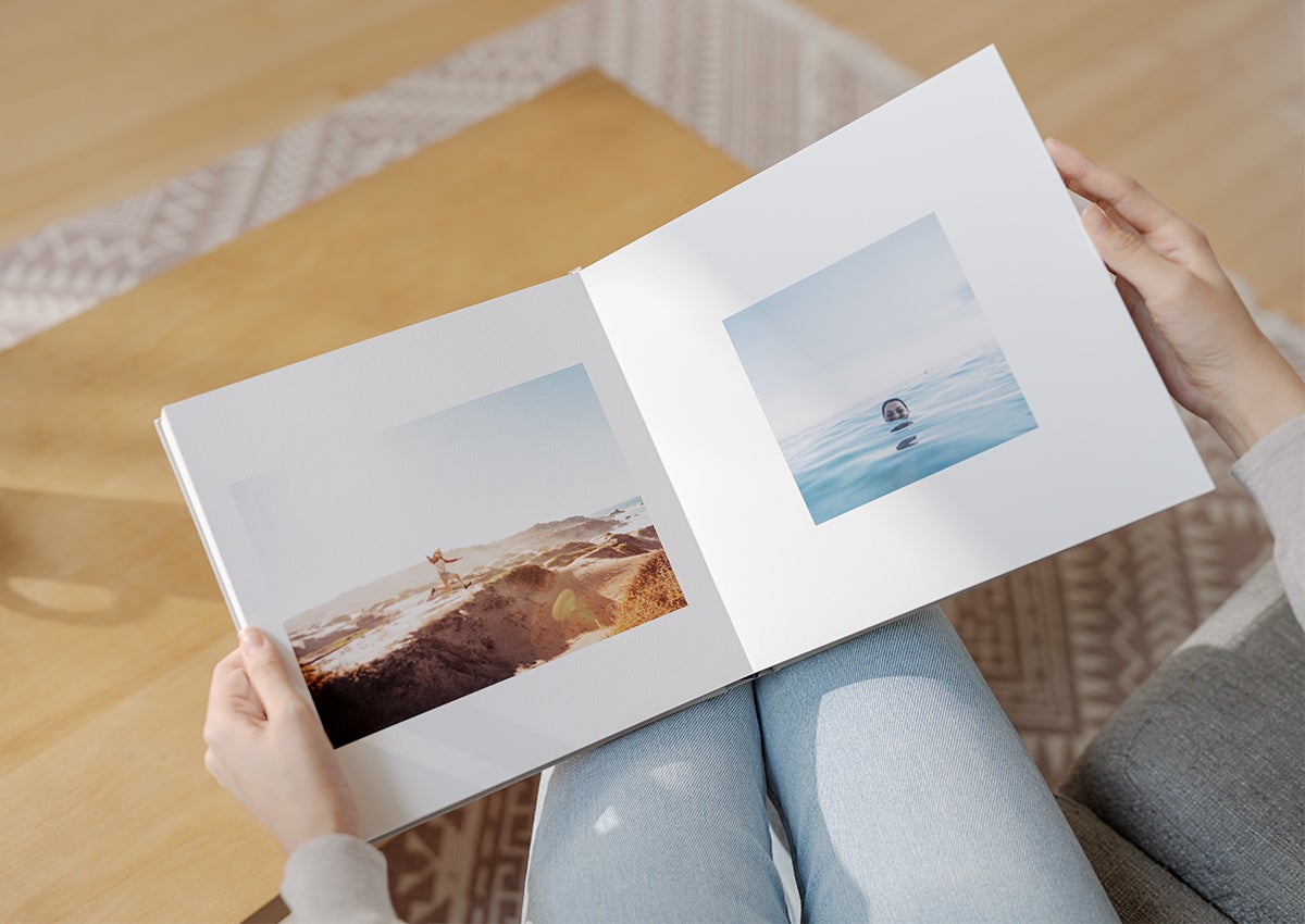 Photo book opened to side by side photos