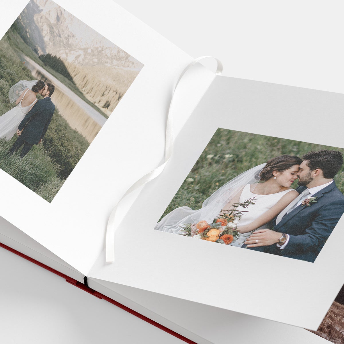 Bookmark ribbon marking page in opened photo album