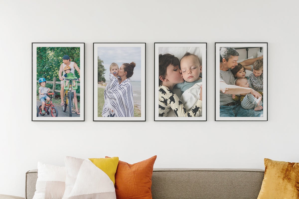 Series of frames hung above couch