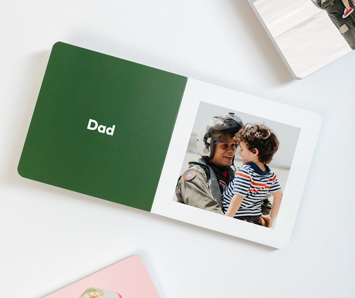 Baby Board Book opened to photo of dad