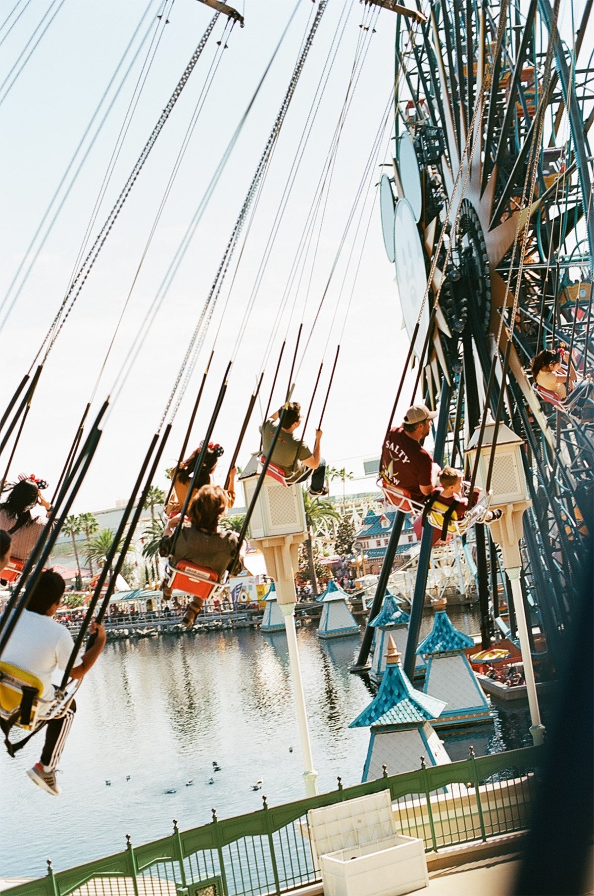 People riding carousel swing ride at an amusement park