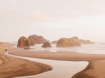 Coastal rock formation on a golden beach