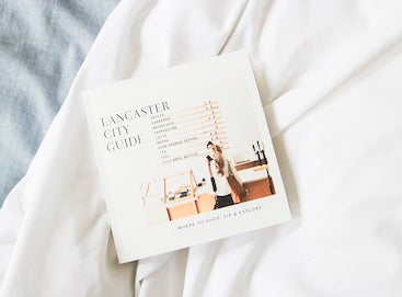 City guide photo book lying on bed