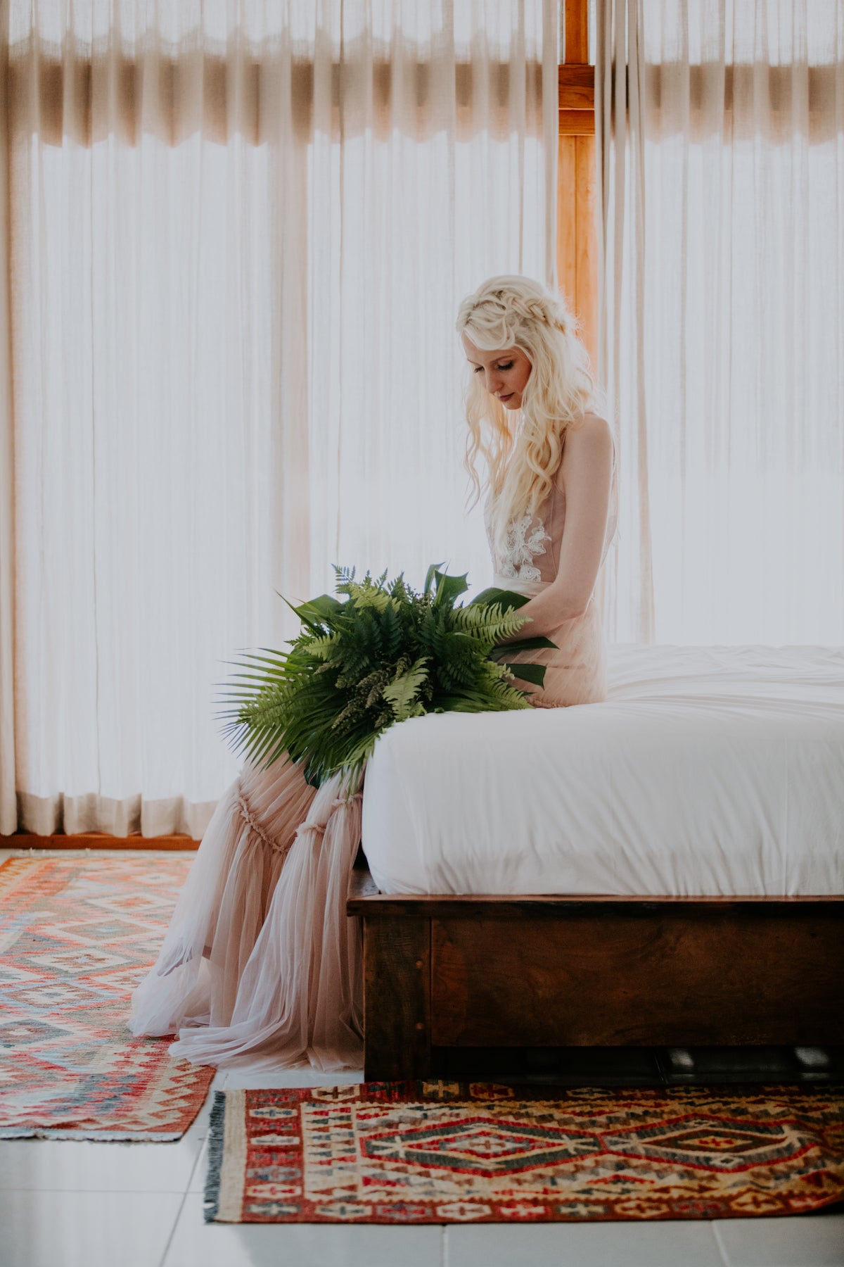 Bride sitting on bed in contemplation