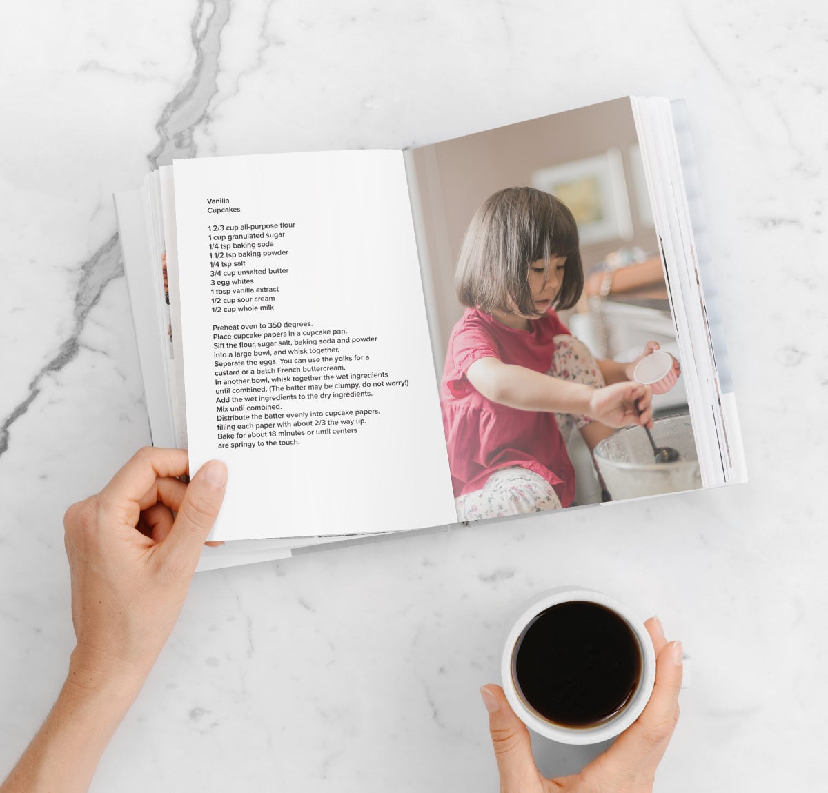 DIY recipe book opened to photo of little girl making cupcakes