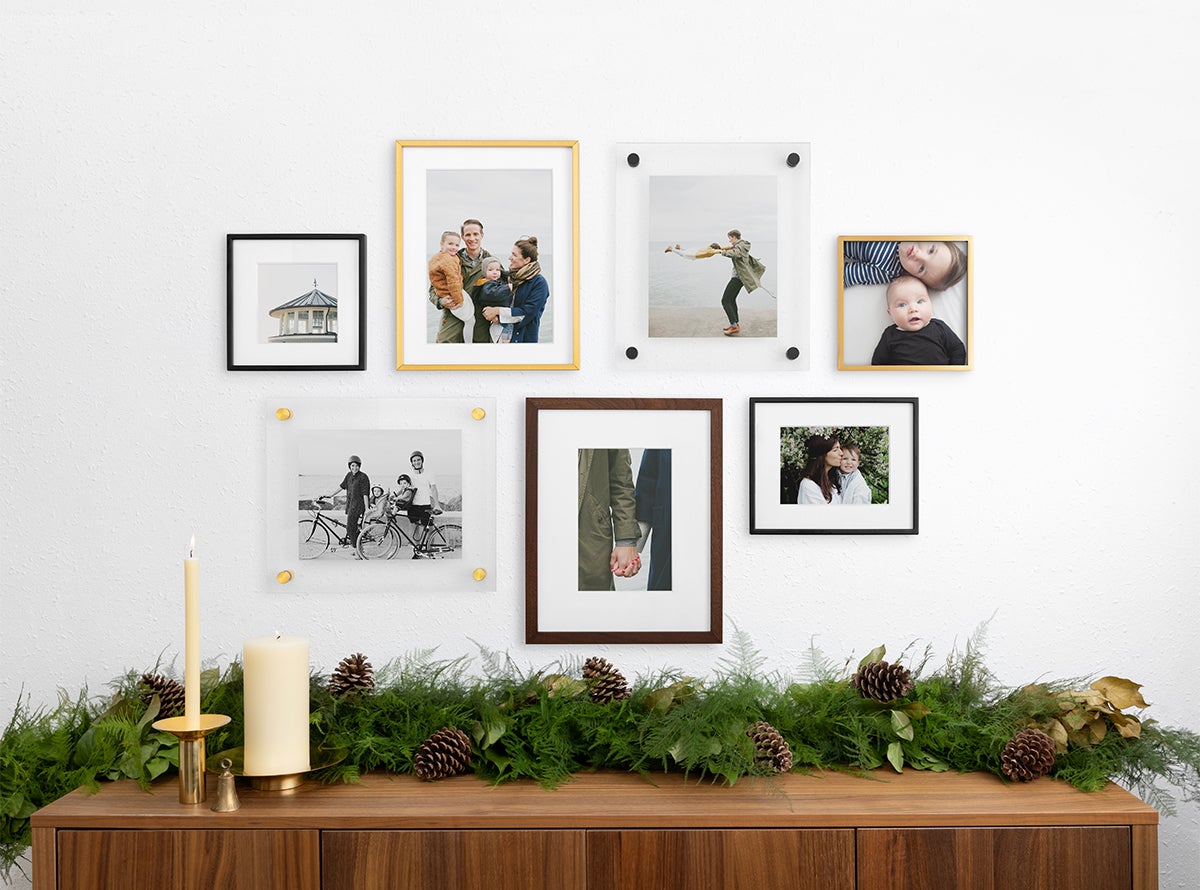 Gallery wall created using assortment of frame styles, sizes, and finishes
