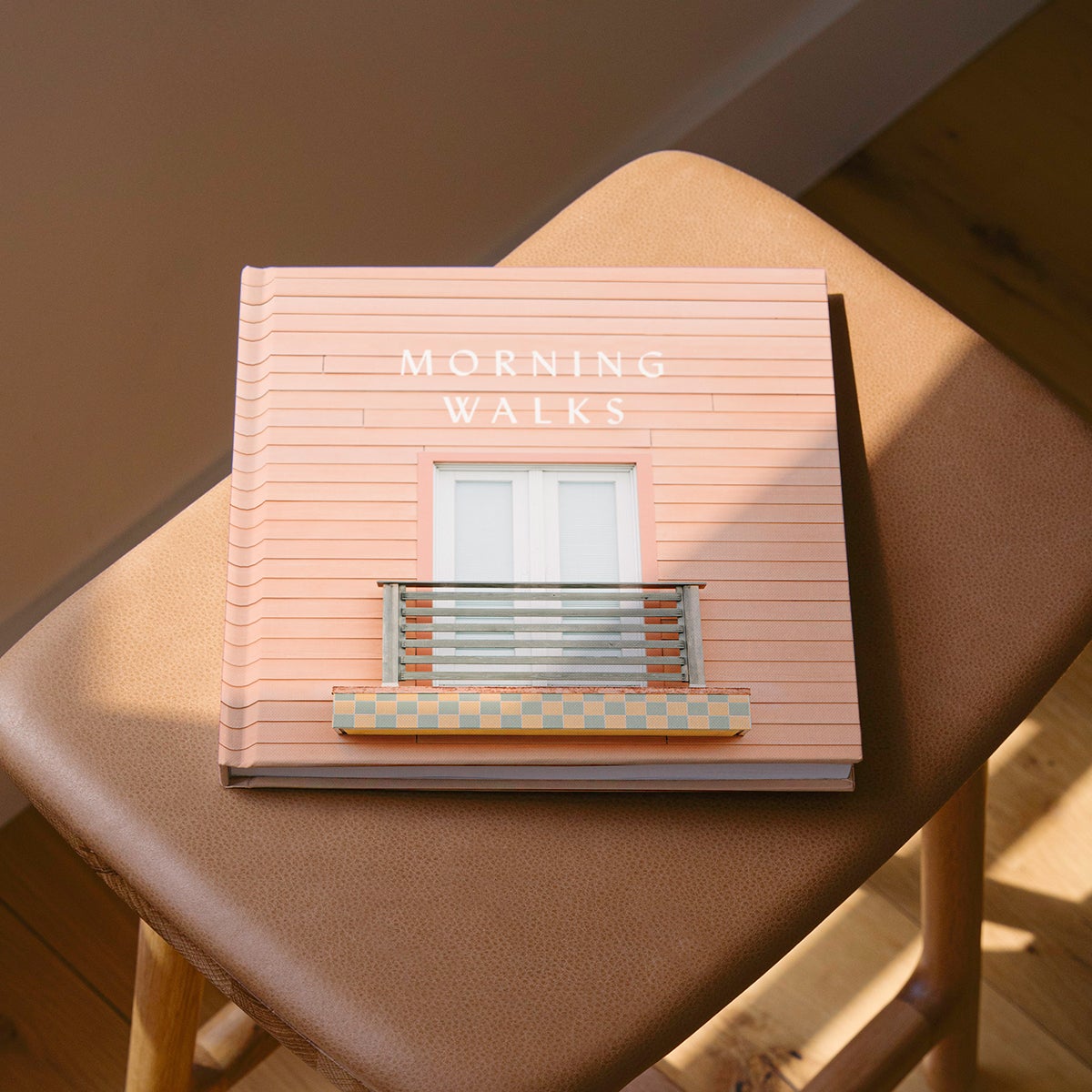 Artifact Uprising Photo-Wrapped Hardcover titled Morning Walks featuring photo of picturesque patio on the cover