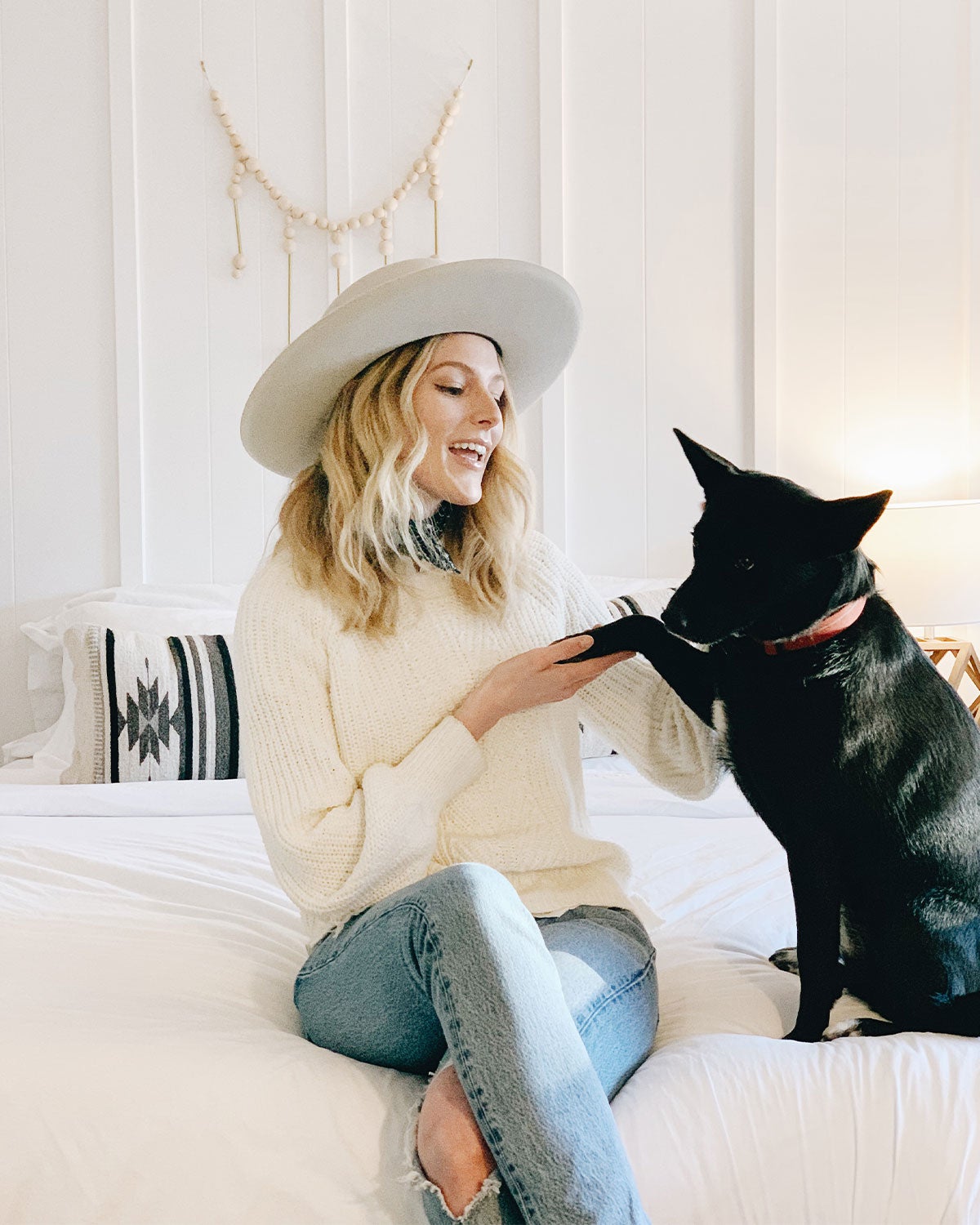 Woman and her dog in a boutique hotel room