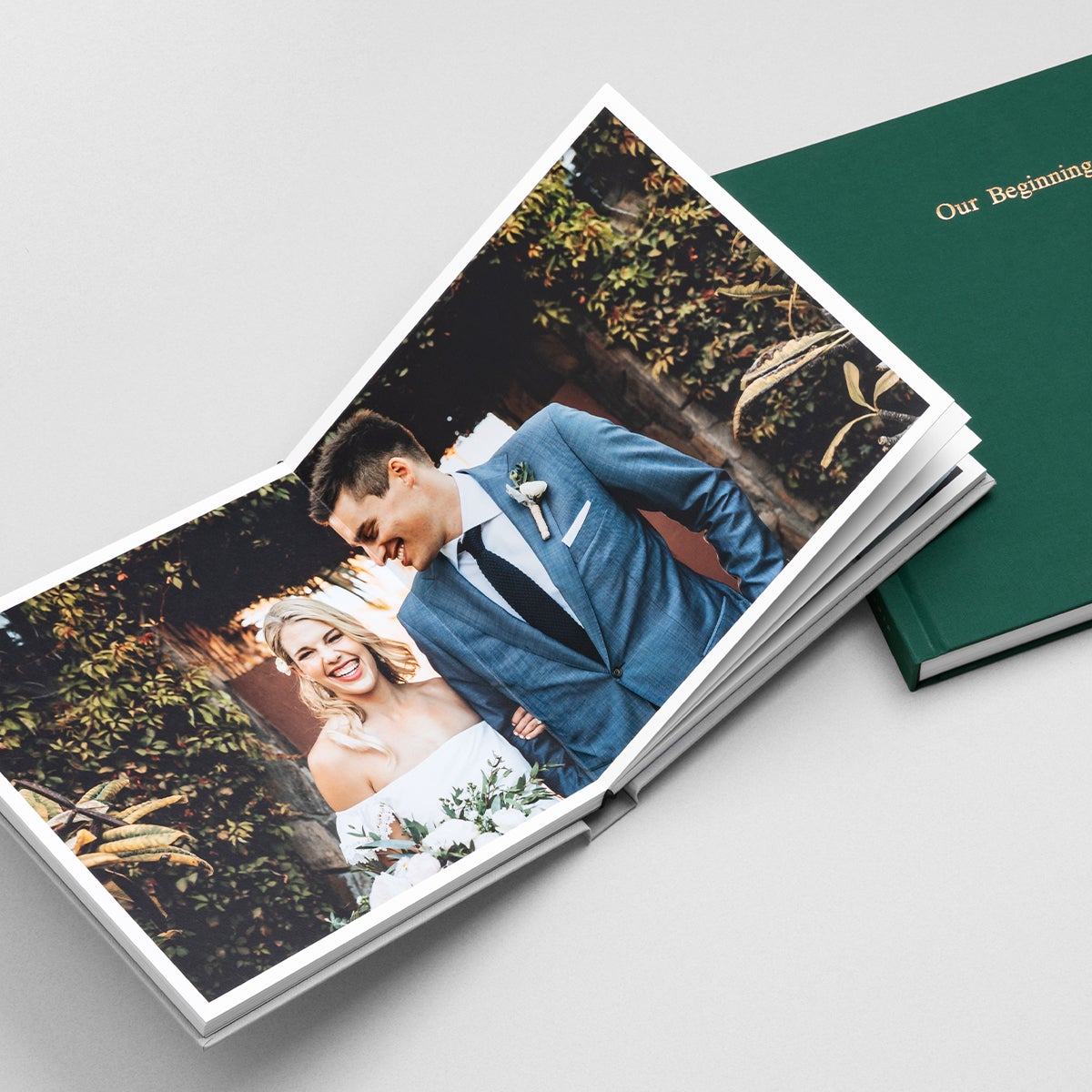 Layflat album opened to two-page photo of bride and groom