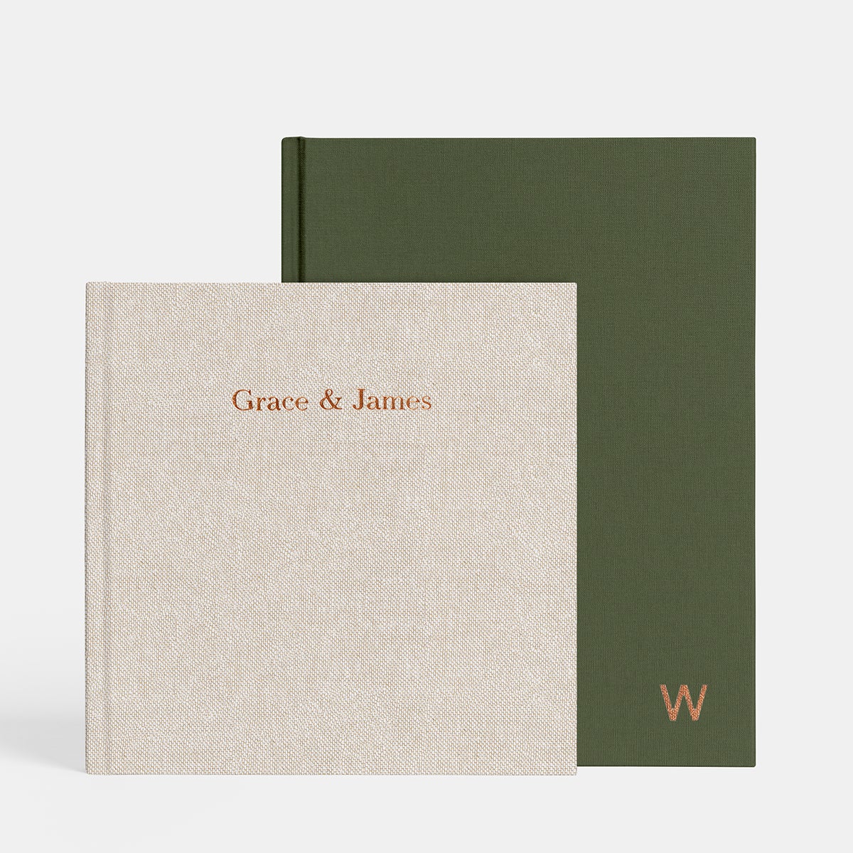 Oatmeal layflat album titled Grace and James stacked in front of olive layflat, both featuring copper foil