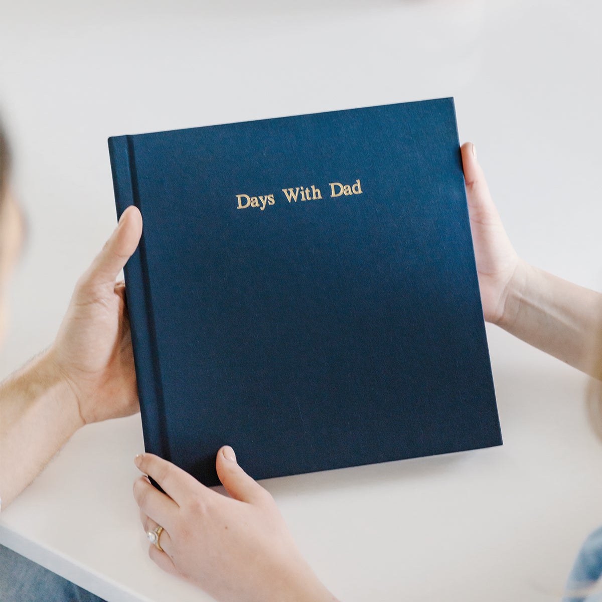 Dark blue Layflat photo album with gold foil stamping on cover