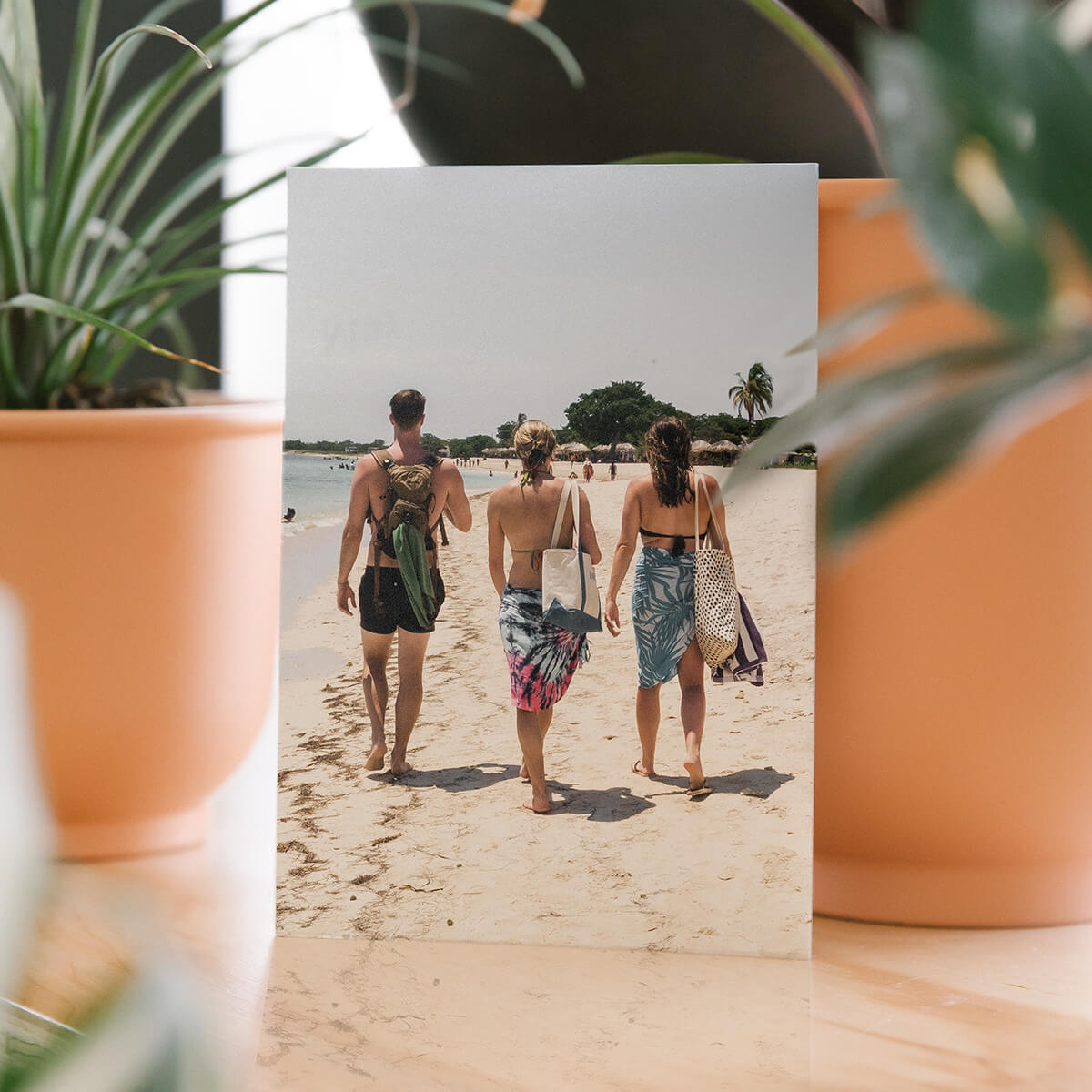 DIY postcard featuring travel photo of friends walking along the beach