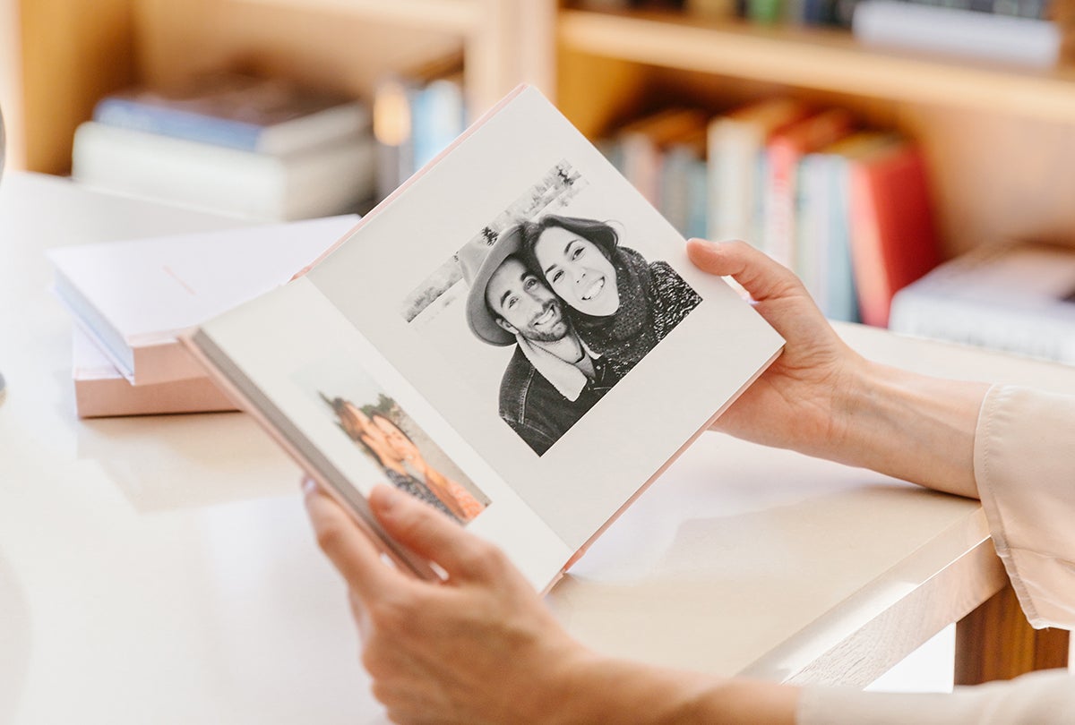 Everyday Photo Book opened to black and white photo of couple on a trip