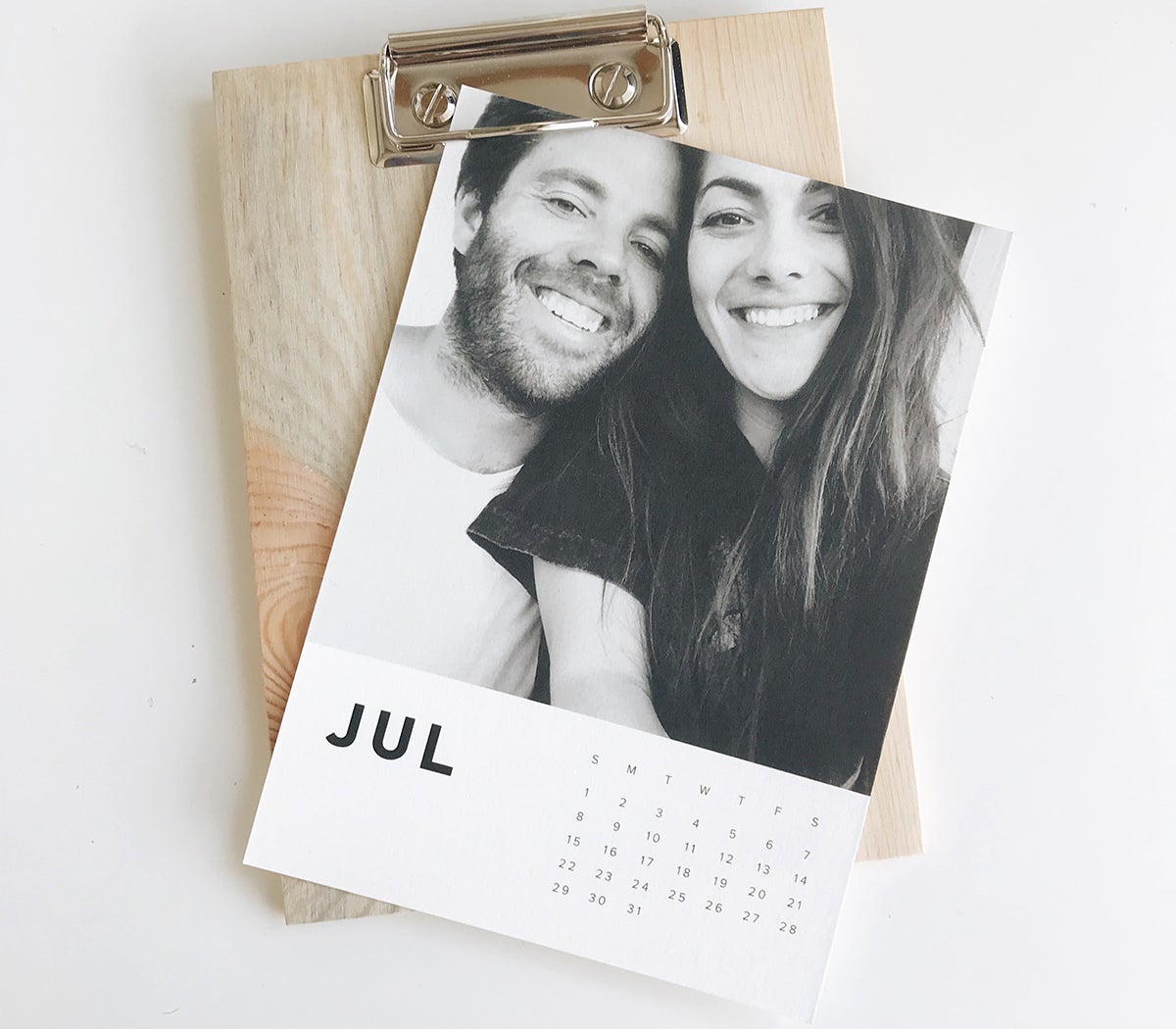 Photo by @relevantraw of Artifact Uprising wood calendar featuring print of couple