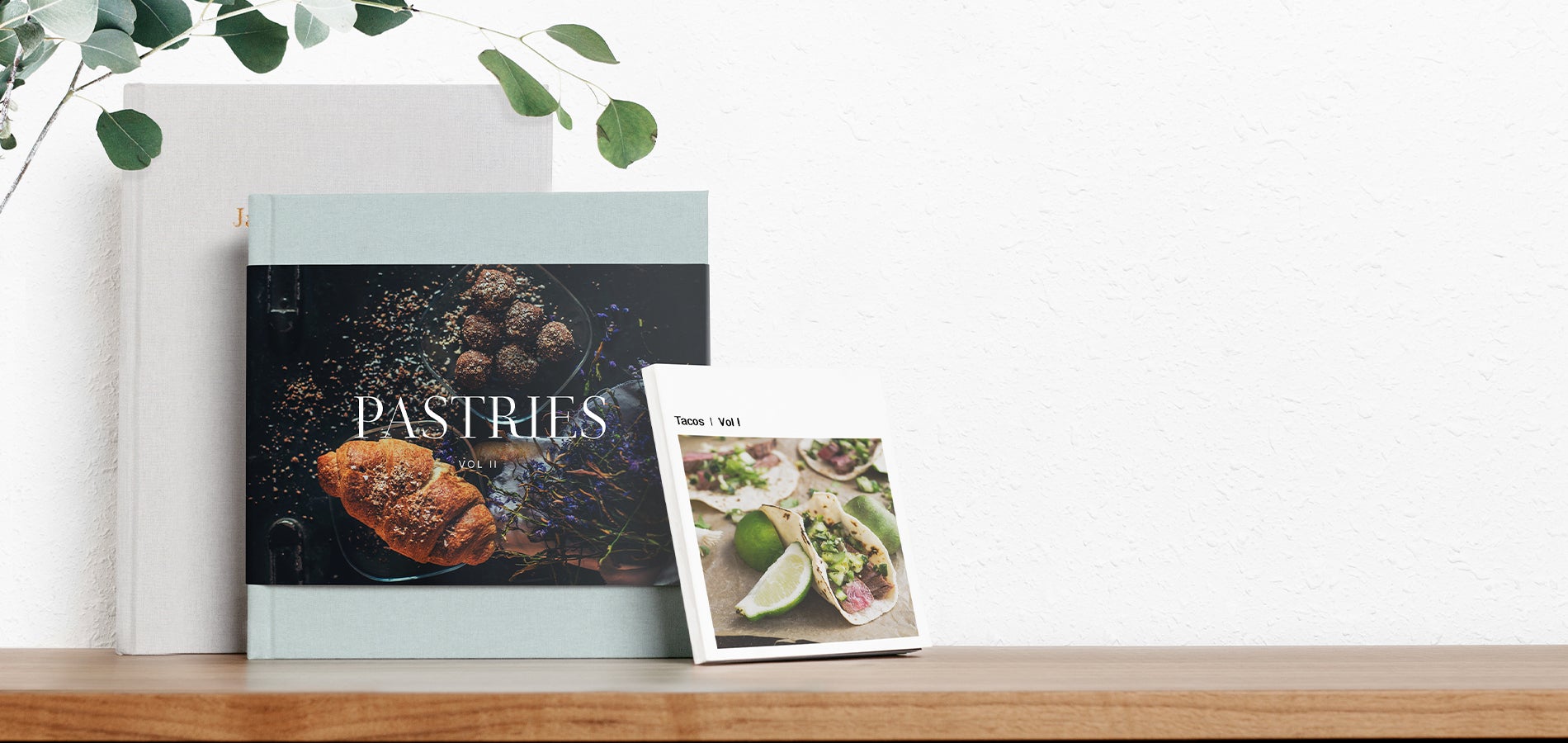 Three different cookbooks created using Artifact Uprising photo books