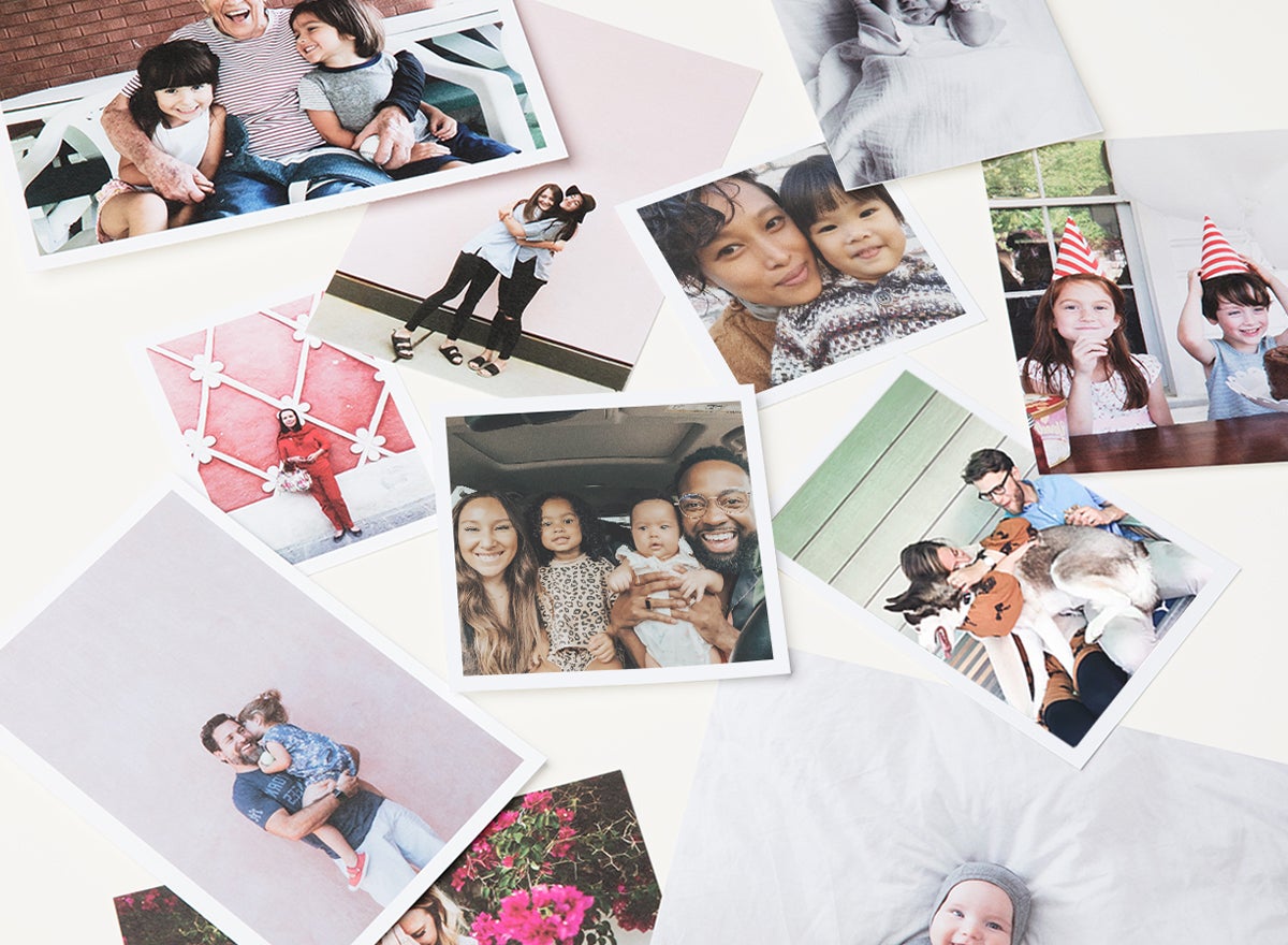 photo prints in different sizes scattered on table