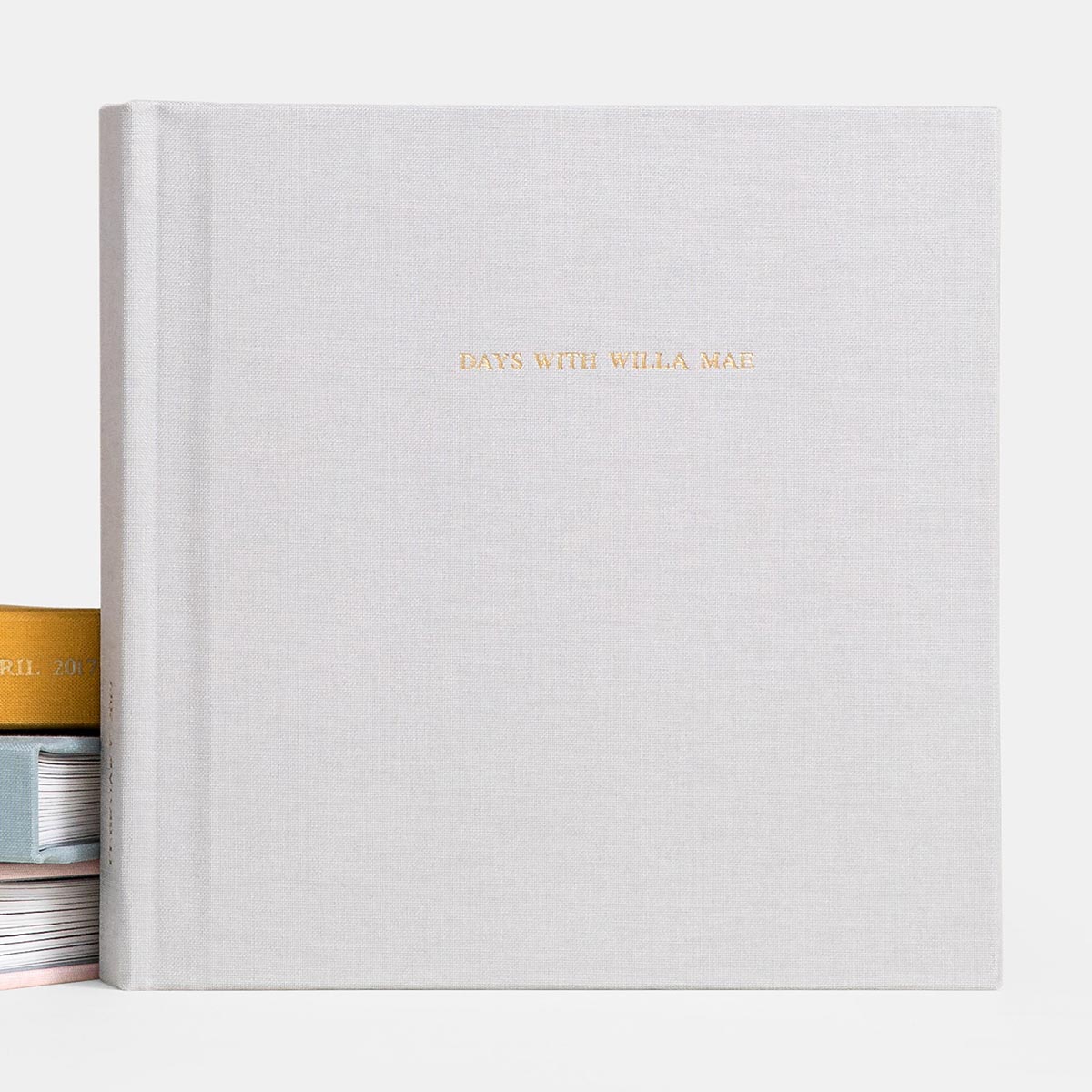 Foil-stamped gold title on cover of Everyday Photo Book titled days with willa mae