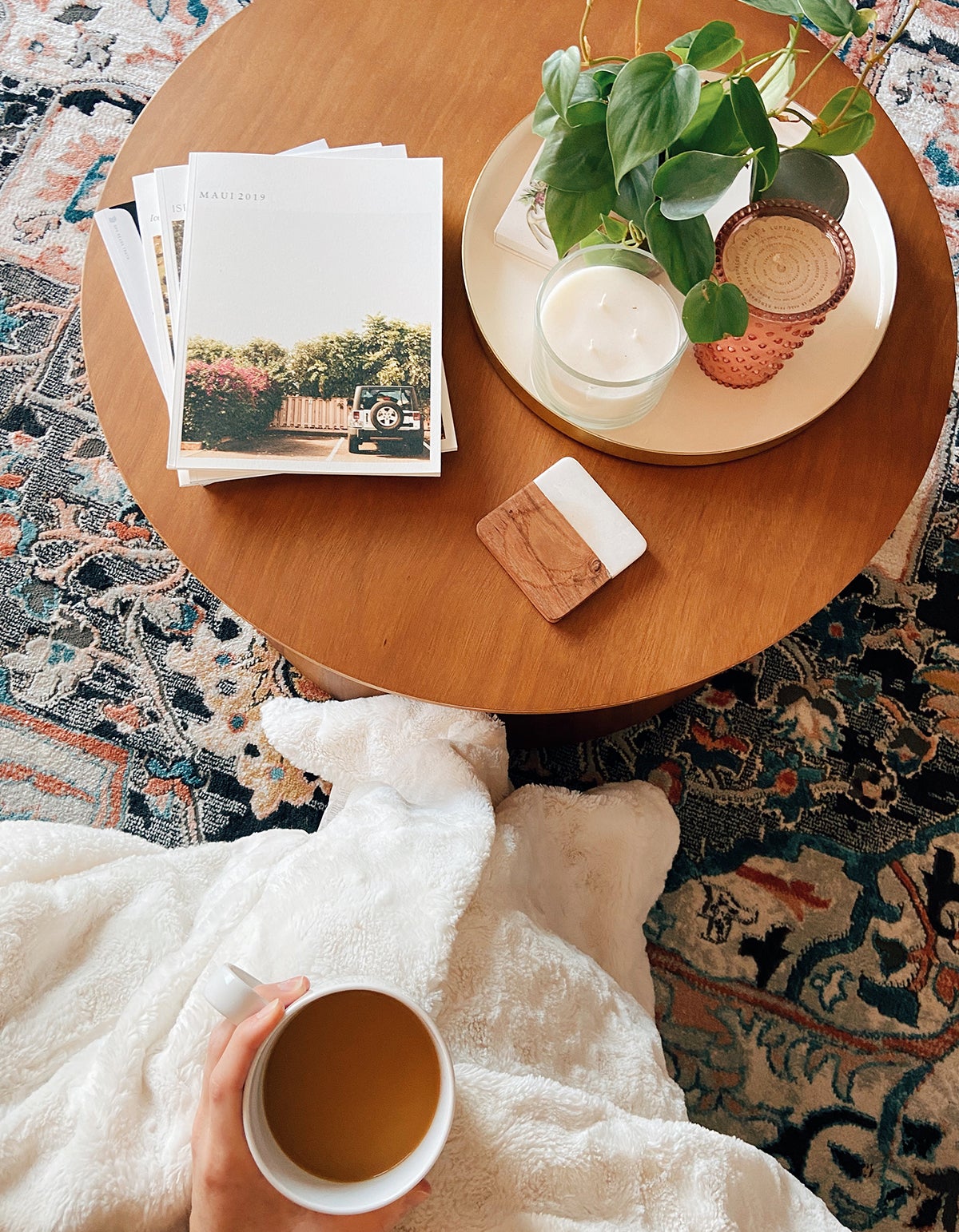 Photo by @jessicalaurensmith of softcover photo books on coffee table