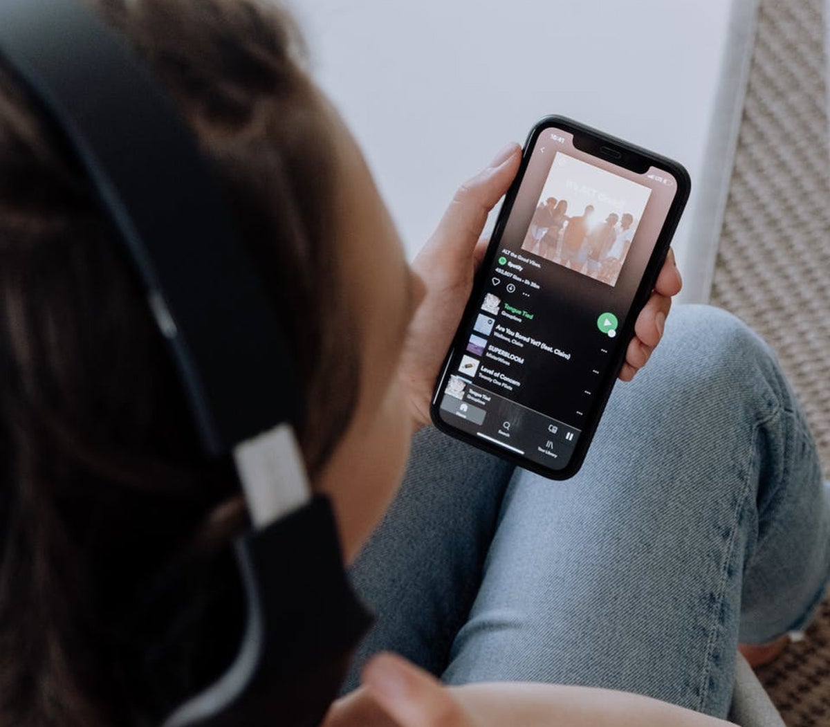 Woman listening to Spotify on her phone