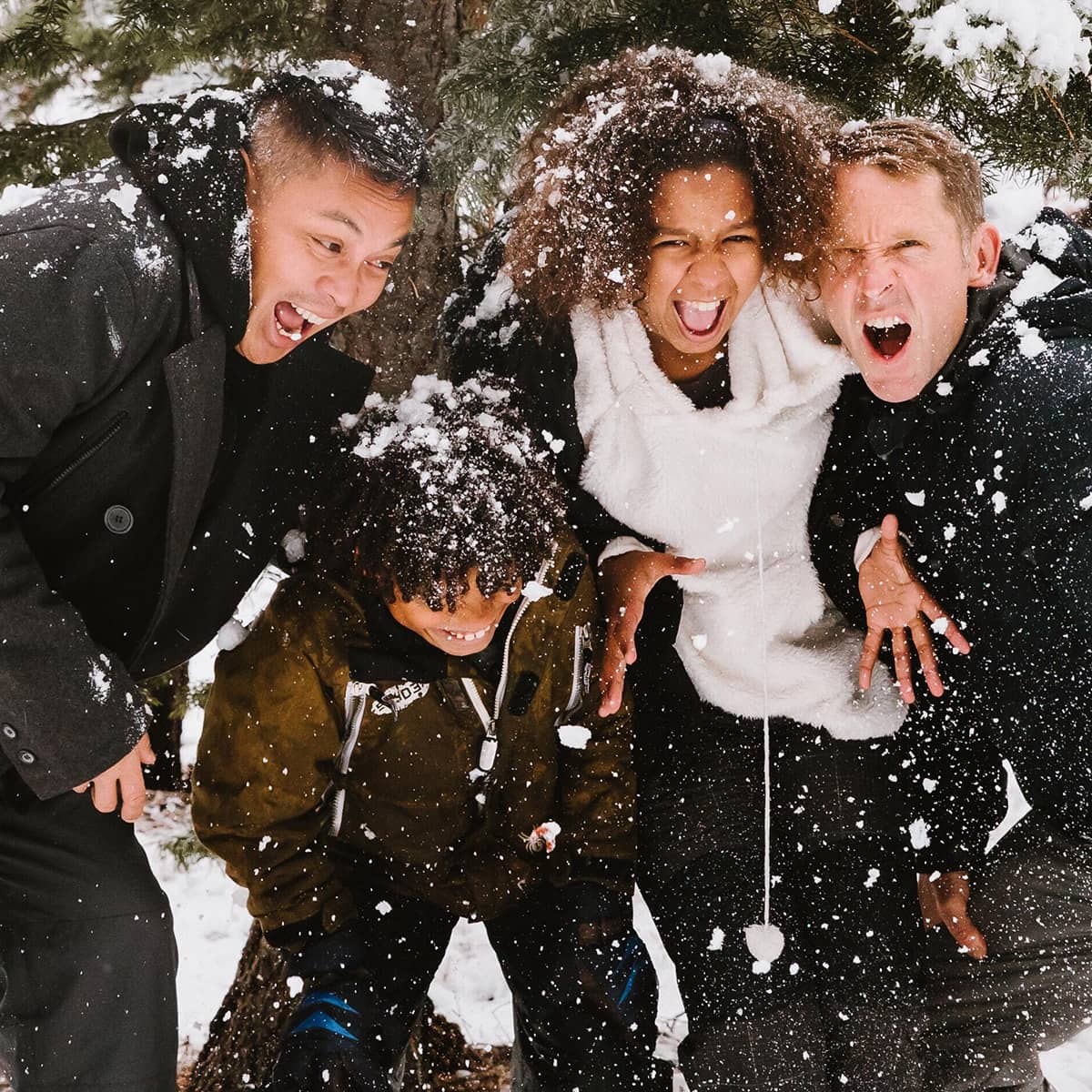 Kids screaming as they play in the snow