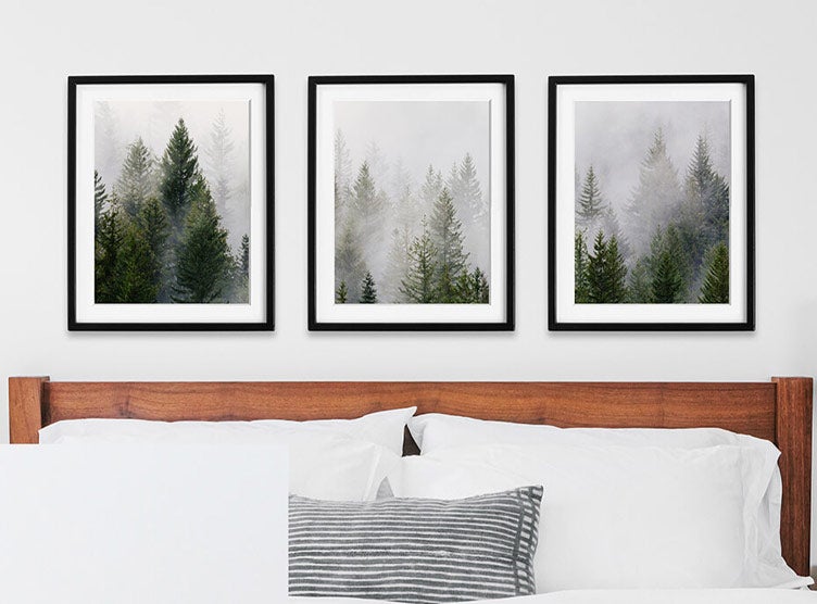 Landscape photo of snowy trees split across three frames in triptych gallery wall