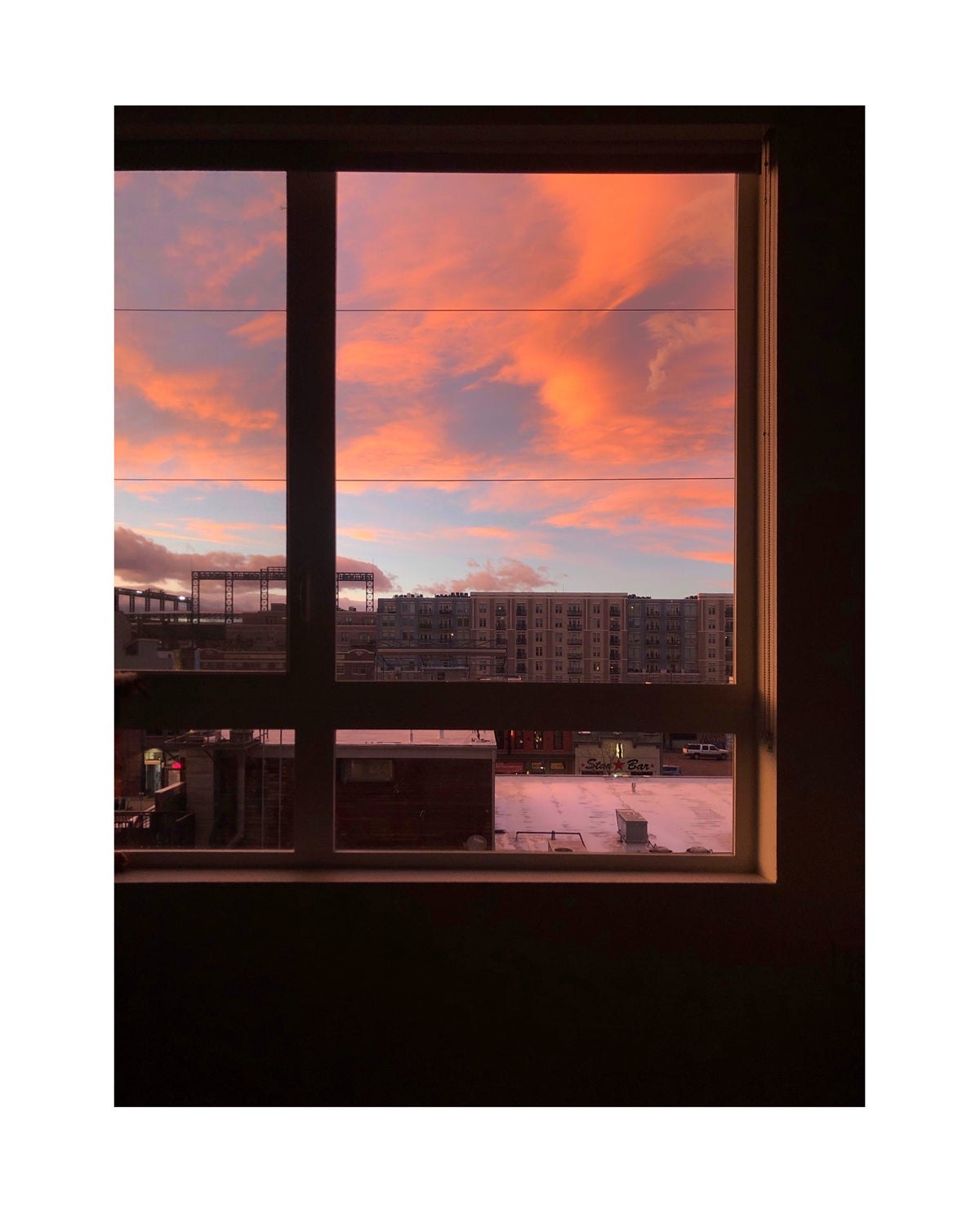 Photo of sunset through window by Molly Olwig