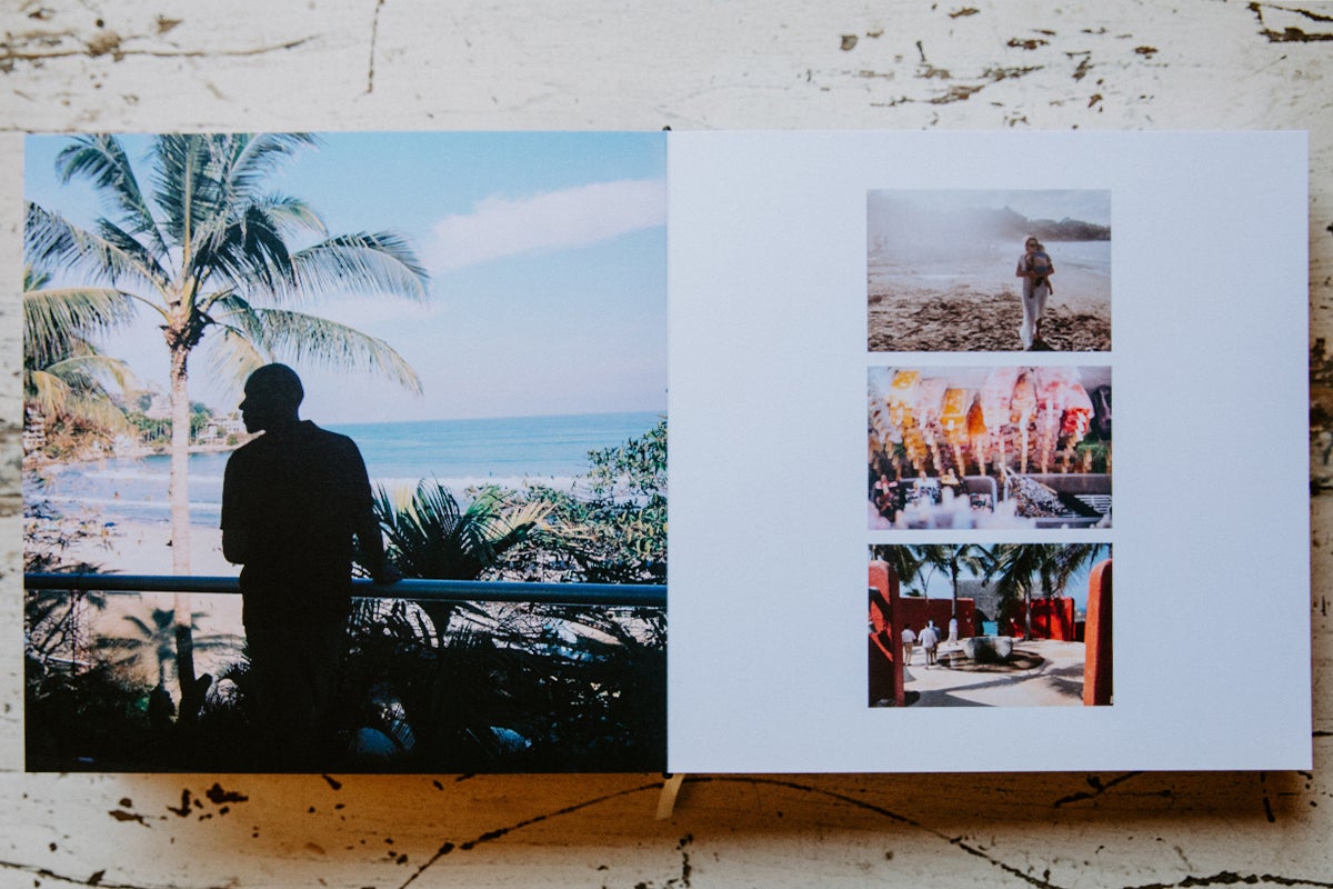 Signature Layflat Album opened to images of various images of the wedding destination